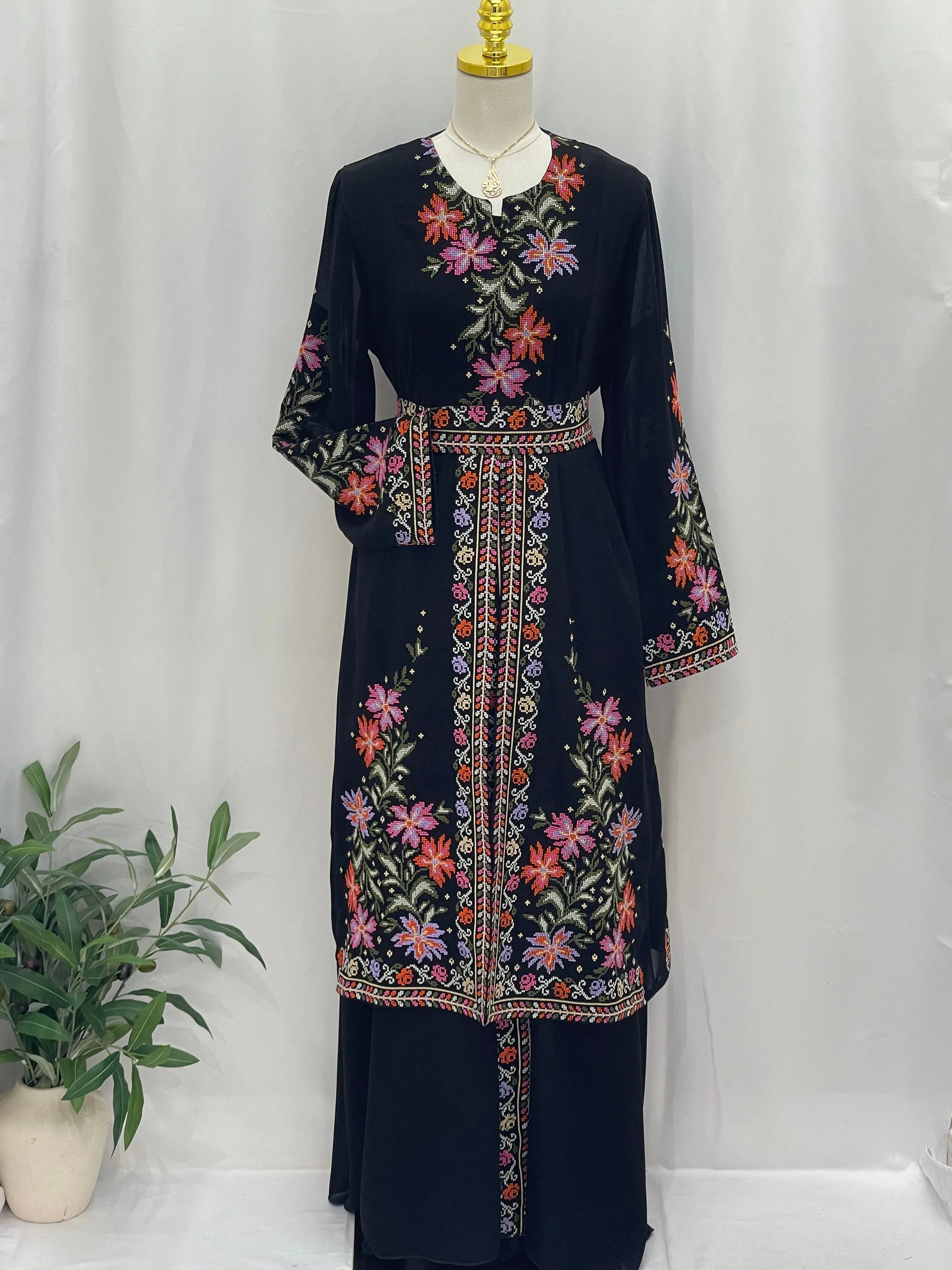 Rose Embroidered Dress Abaya featuring vibrant floral designs on a black fabric for elegant occasions