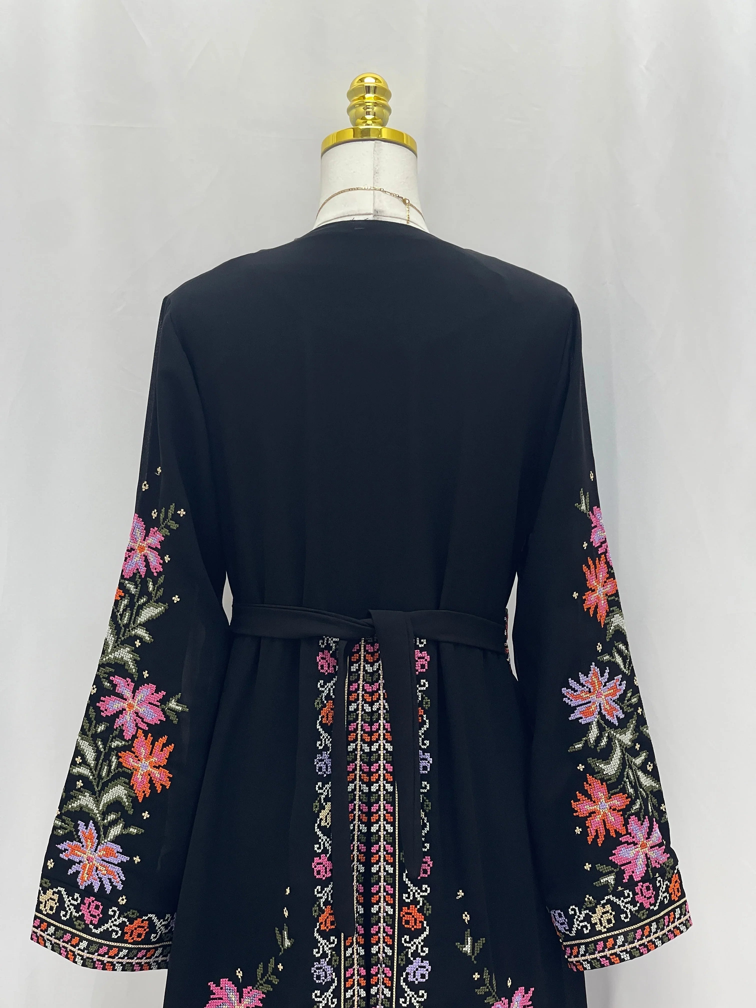Back view of Rose Embroidered Dress Abaya featuring vibrant floral embroidery and a belted waist