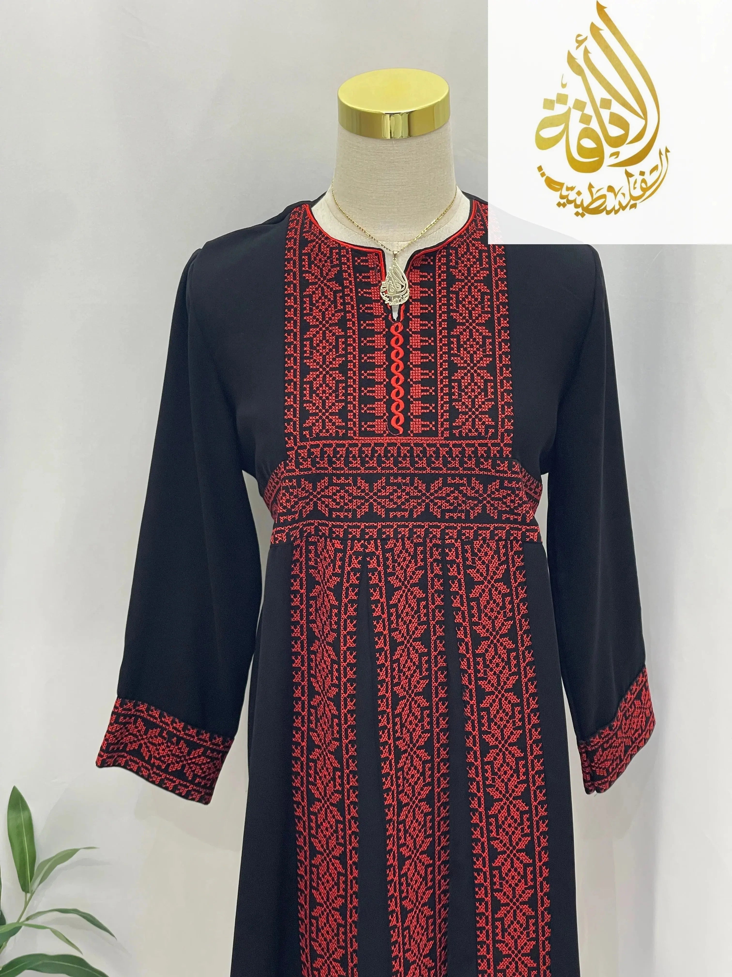 Palestinian Elegance kid's dress featuring Haya Embroidered Abaya with red and black intricate embroidery