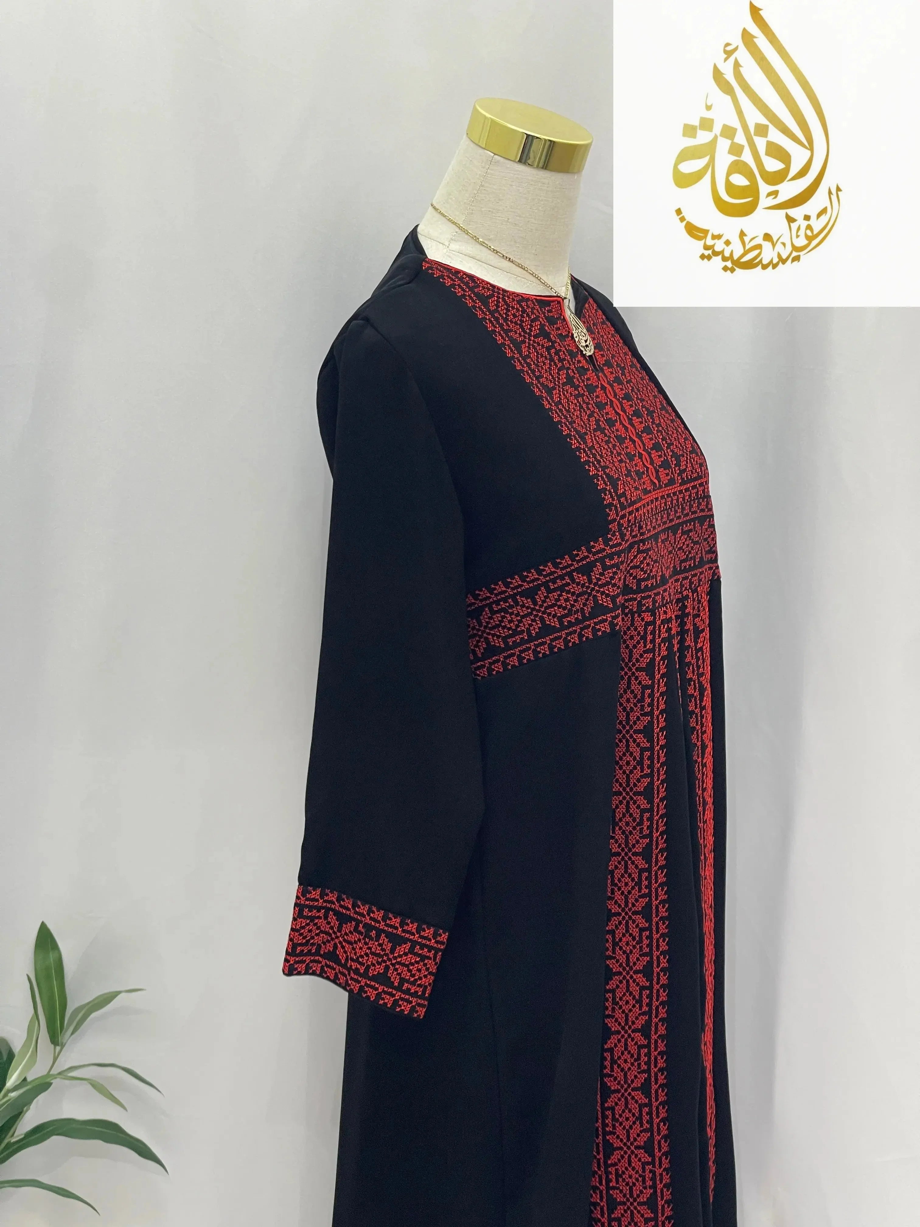 Palestinian Elegance Kid's Haya Embroidered Abaya in black with red intricate embroidery on front and sleeves