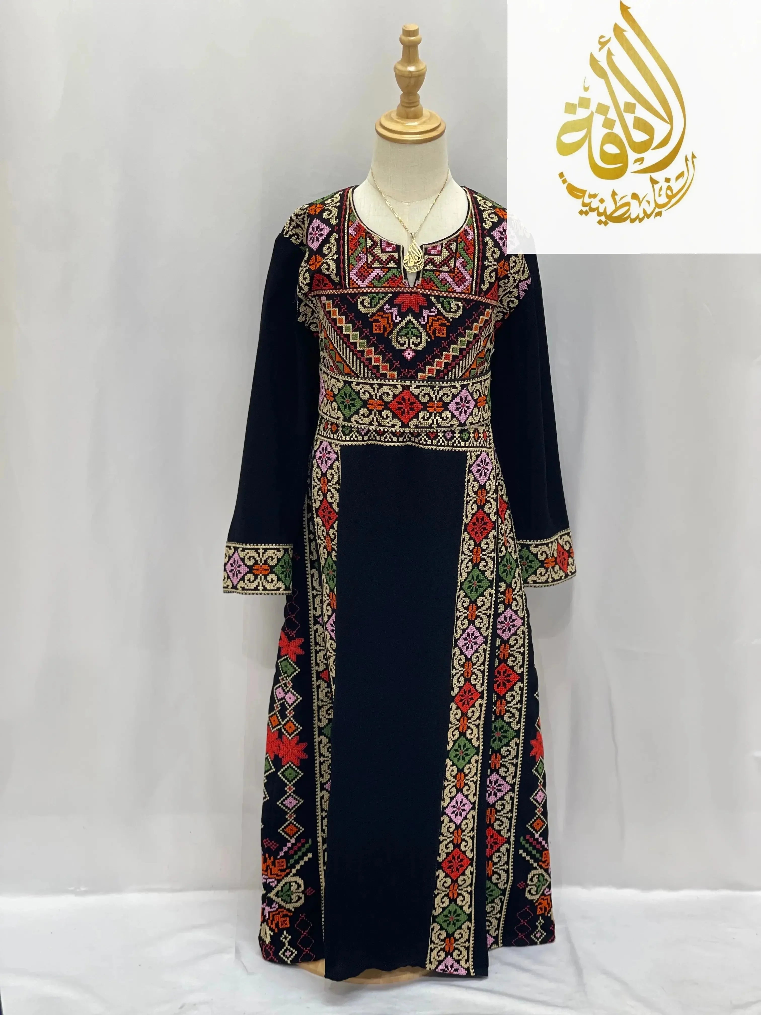 Palestinian Elegance embroidered thoub for girls with colorful traditional patterns on navy fabric