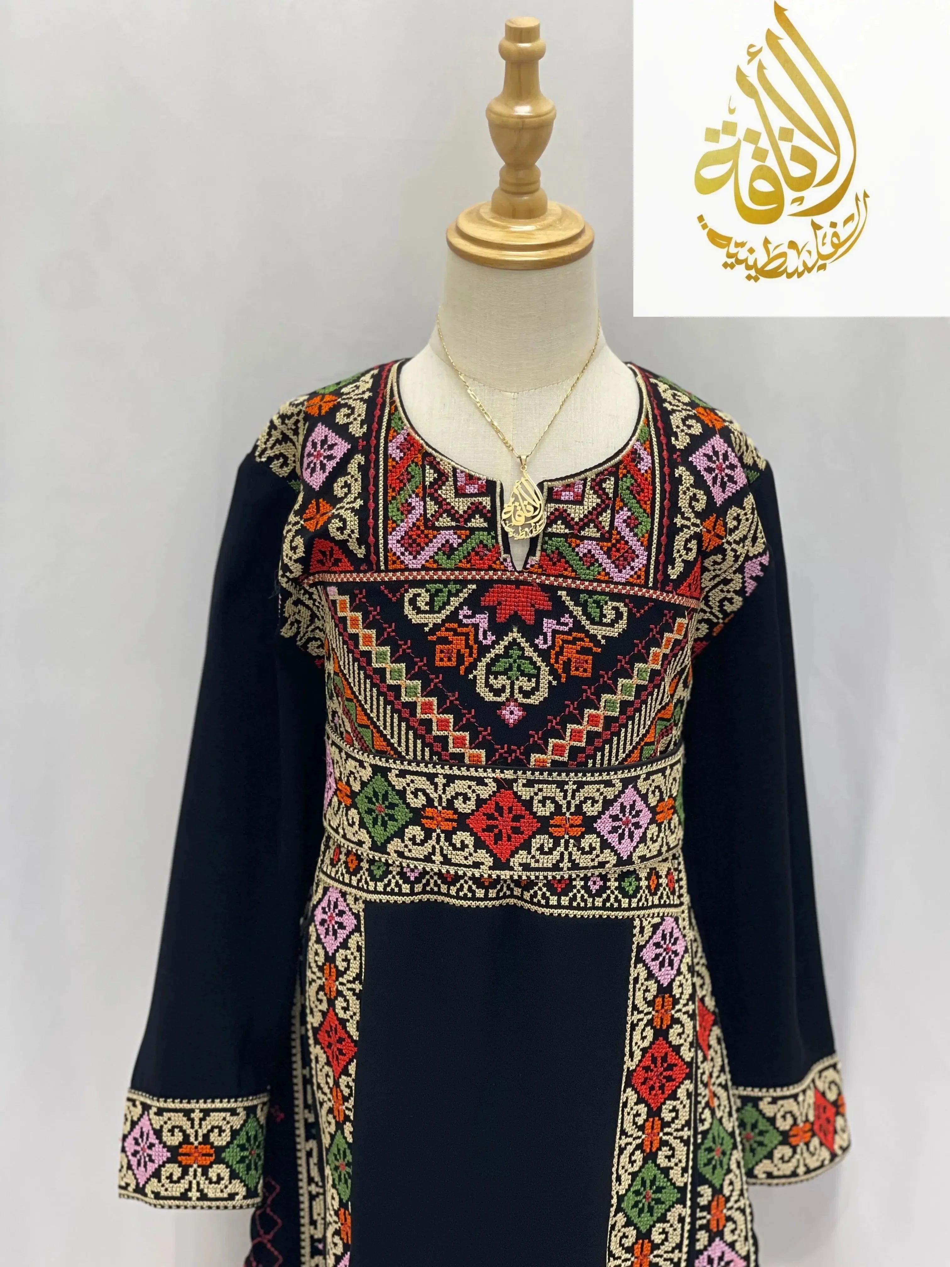 Palestinian Elegance embroidered thoub for girls with colorful traditional patterns on black fabric