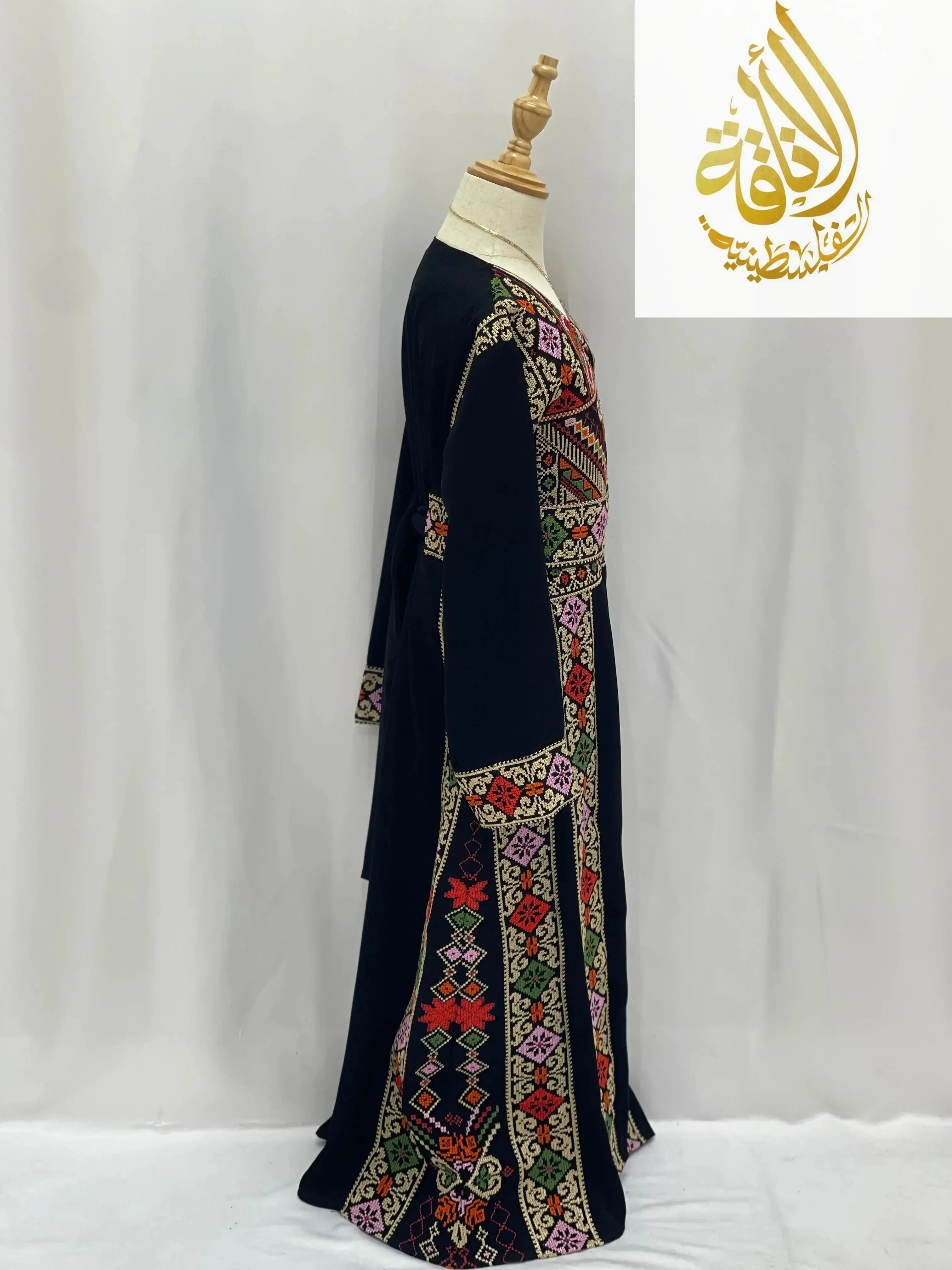 Palestinian Elegance embroidered thoub for girls in black with colorful traditional geometric patterns