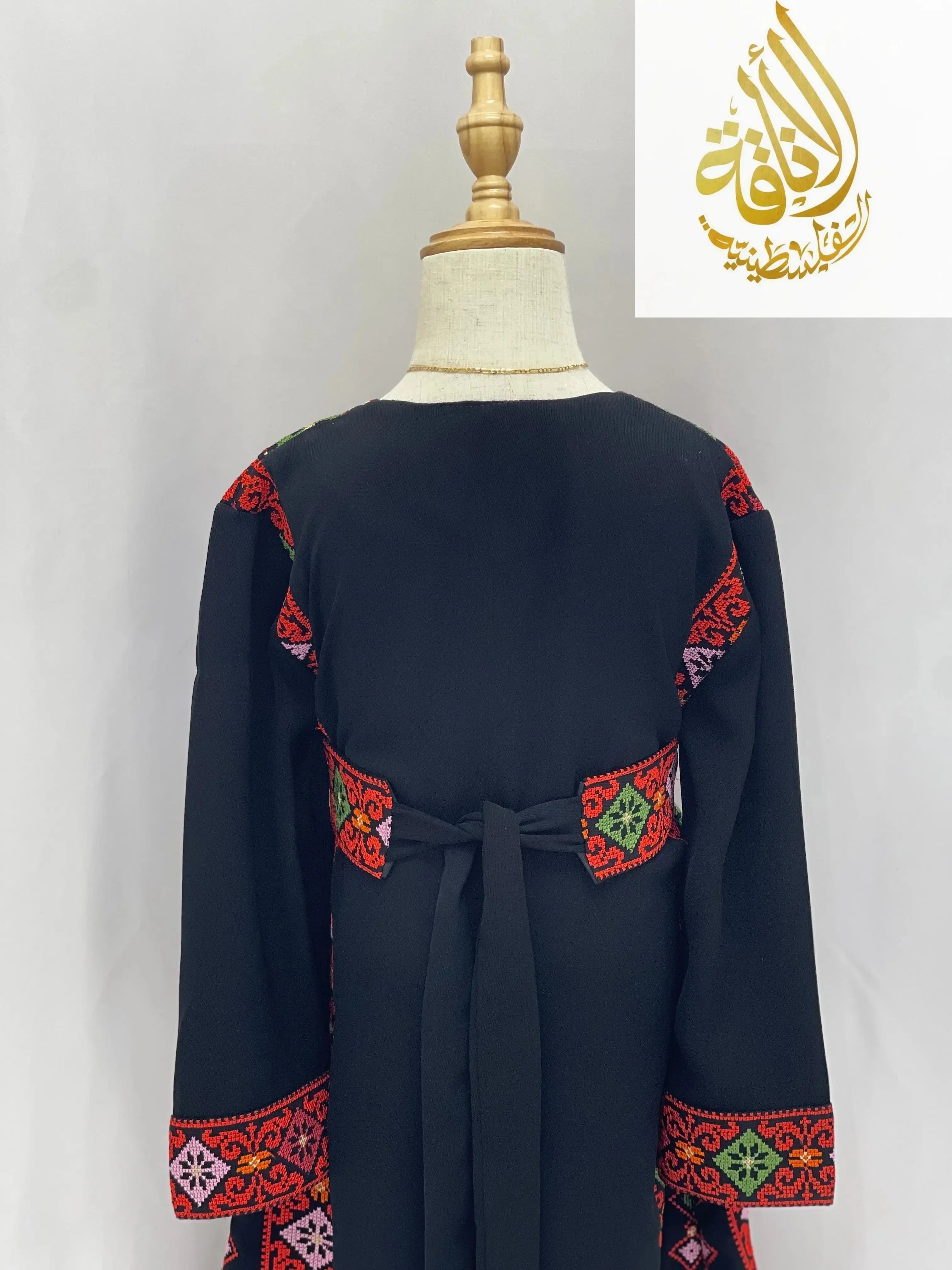 Black embroidered thoub for girls with vibrant red and green traditional embroidery on sleeves and waist