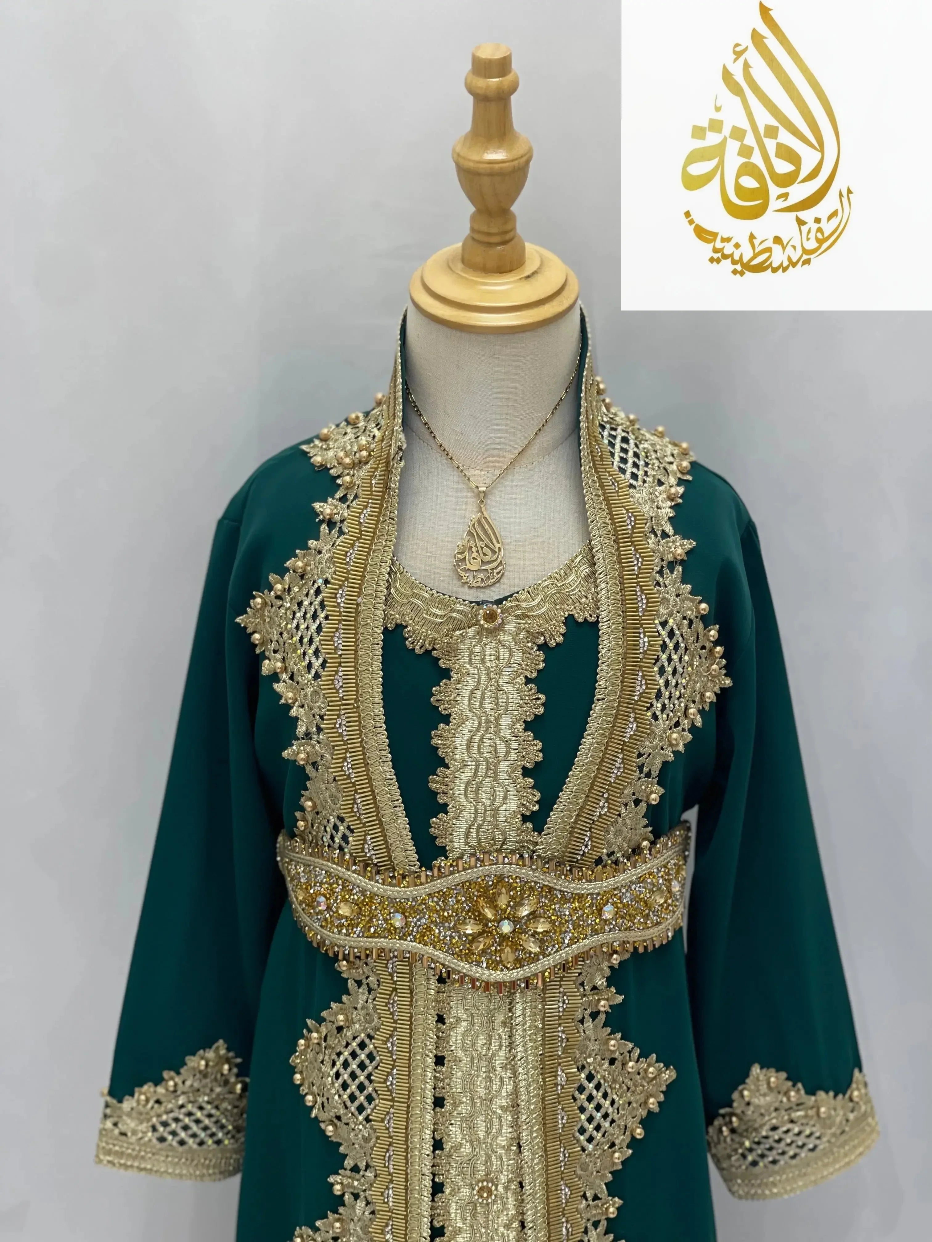 Princess Sema Girls Luxury Kaftan by Palestinian Elegance in green with intricate gold embroidery and detailed belt