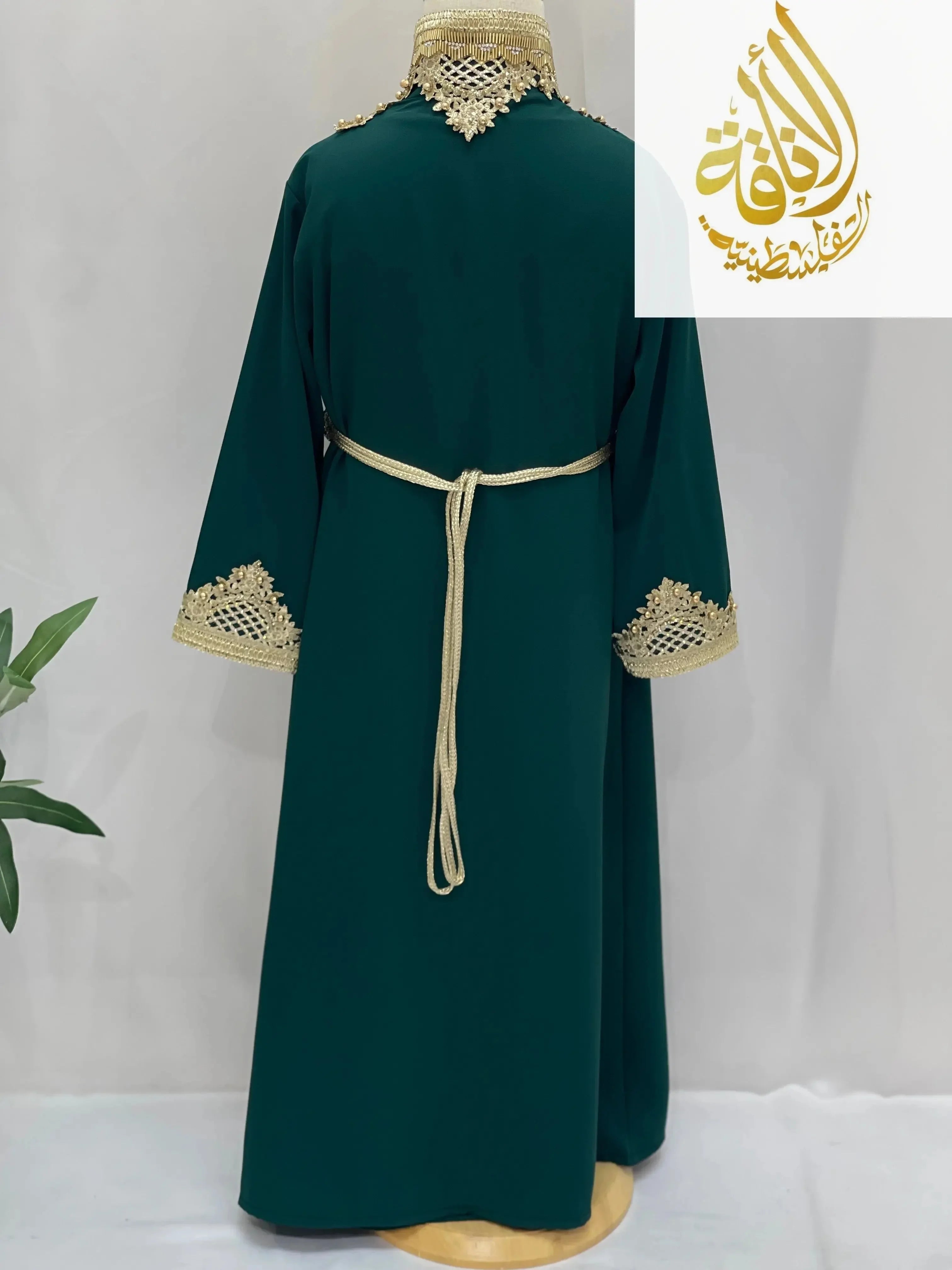 Back view of Princess Sema Girls Luxury Kaftan in green with gold embroidery with belt by Palestinian Elegance
