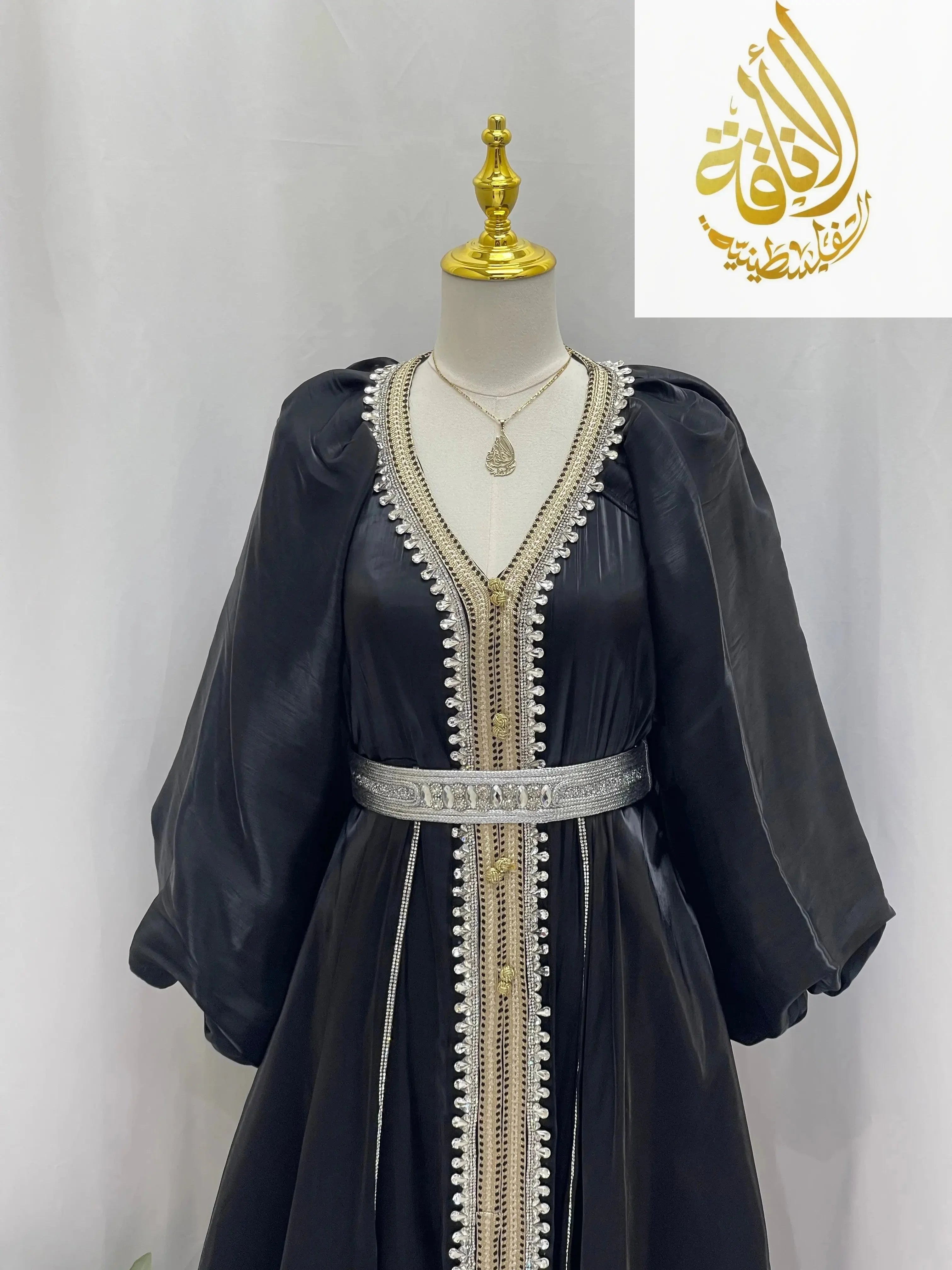 Palestinian Elegance black puffy sleeves kaftan dress with metallic belt and decorative trim