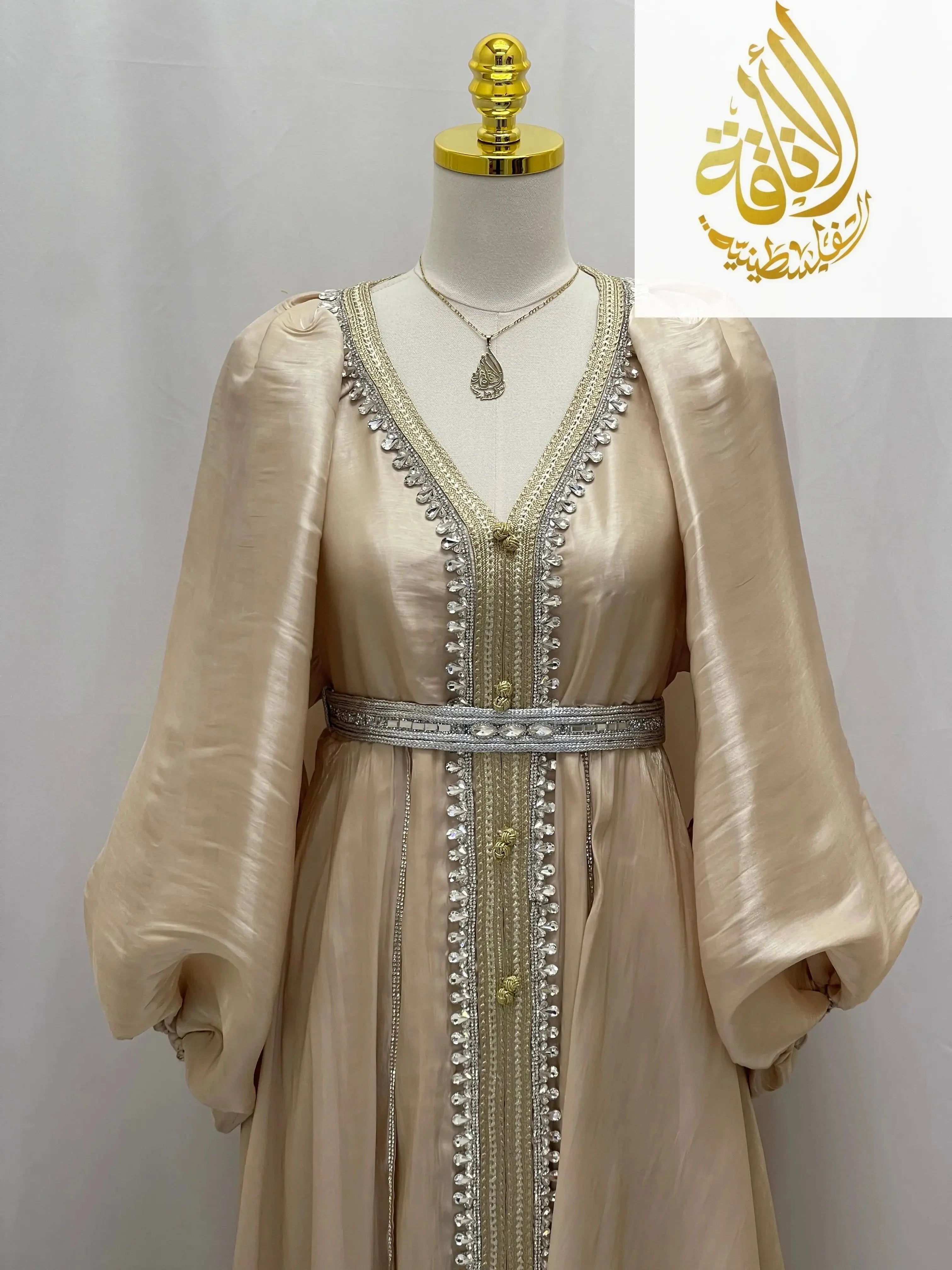 Palestinian Elegance beige puffy sleeves kaftan dress with silver embroidery and embellished belt