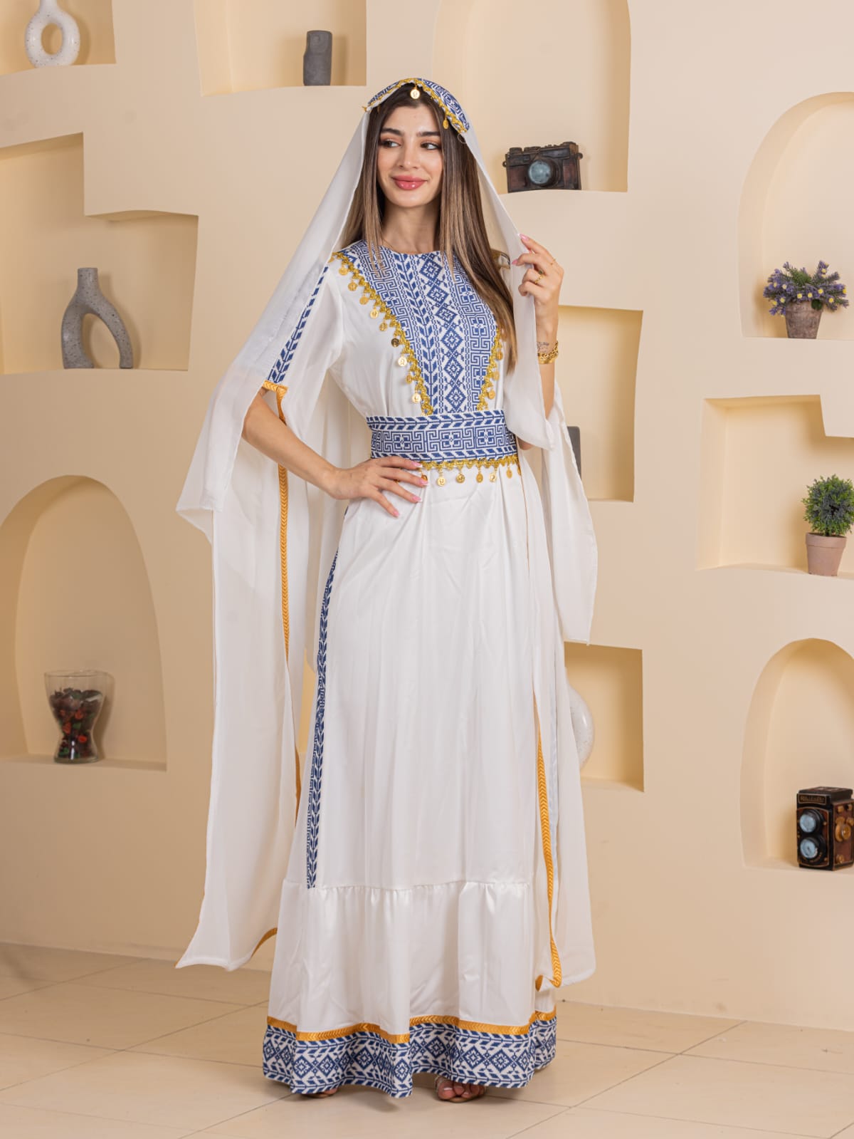 Palestinian Elegance Qamar Embroidered Dress white maxi with blue and gold embroidery belted waist and veil