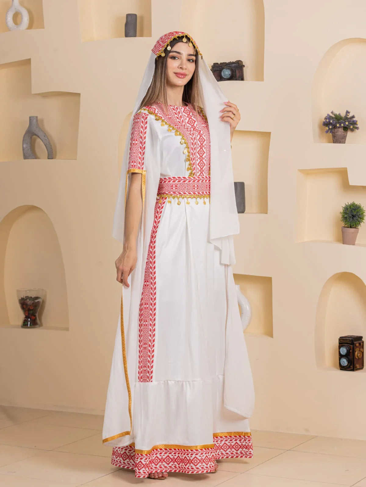 Qamar Embroidered Dress by Palestinian Elegance white traditional gown with red cross stitch embroidery and gold trim