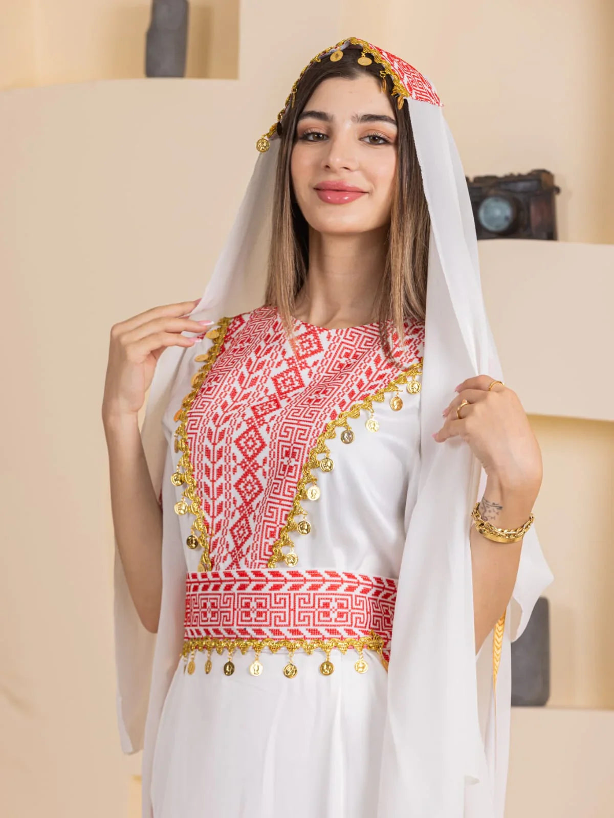 Palestinian Elegance Qamar Embroidered Dress white gown with red geometric embroidery gold coin trim and headscarf