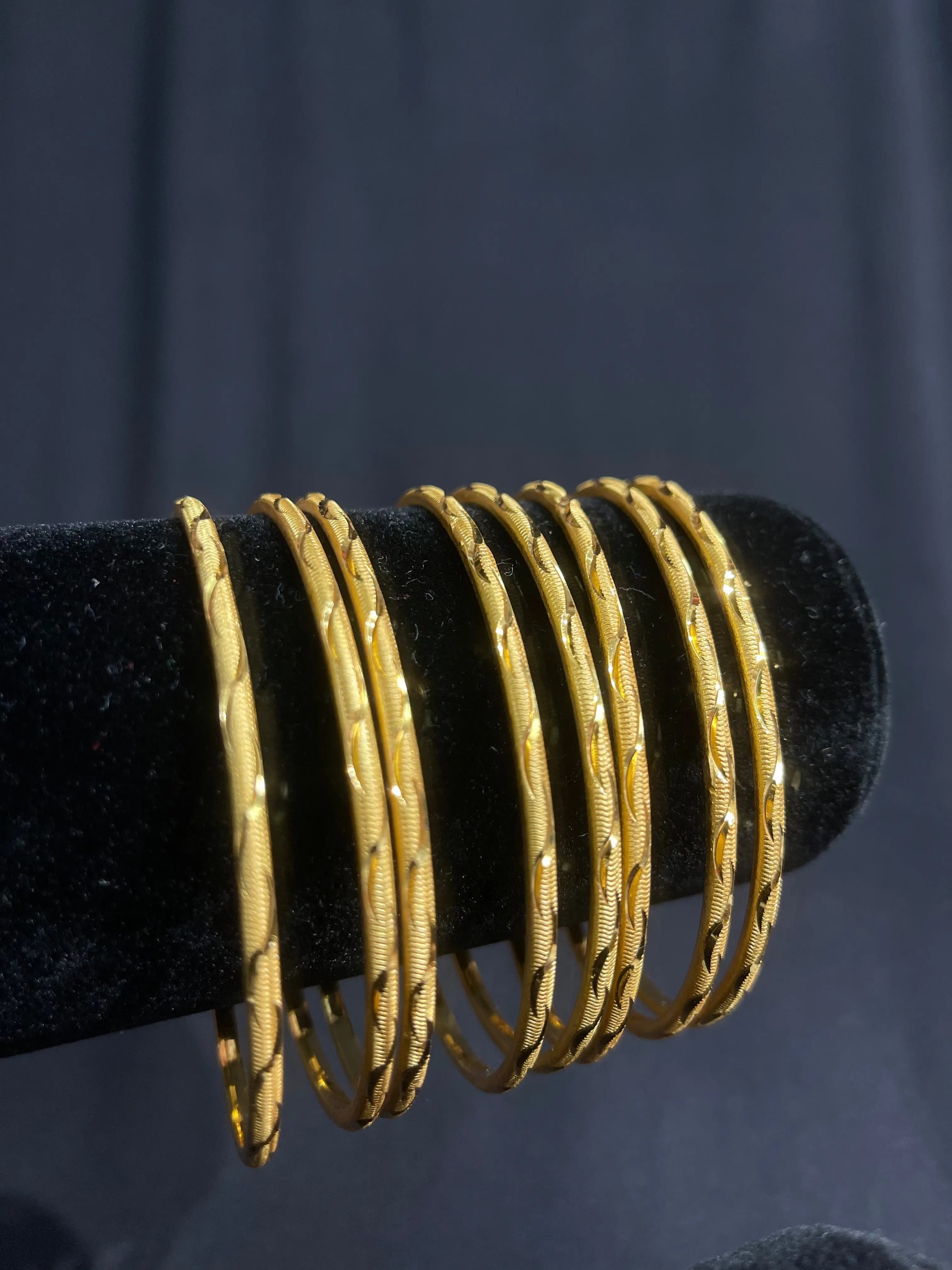 Qamar Thin Bangles Set of 8 imitated gold bangles with intricate texture by Palestinian Elegance