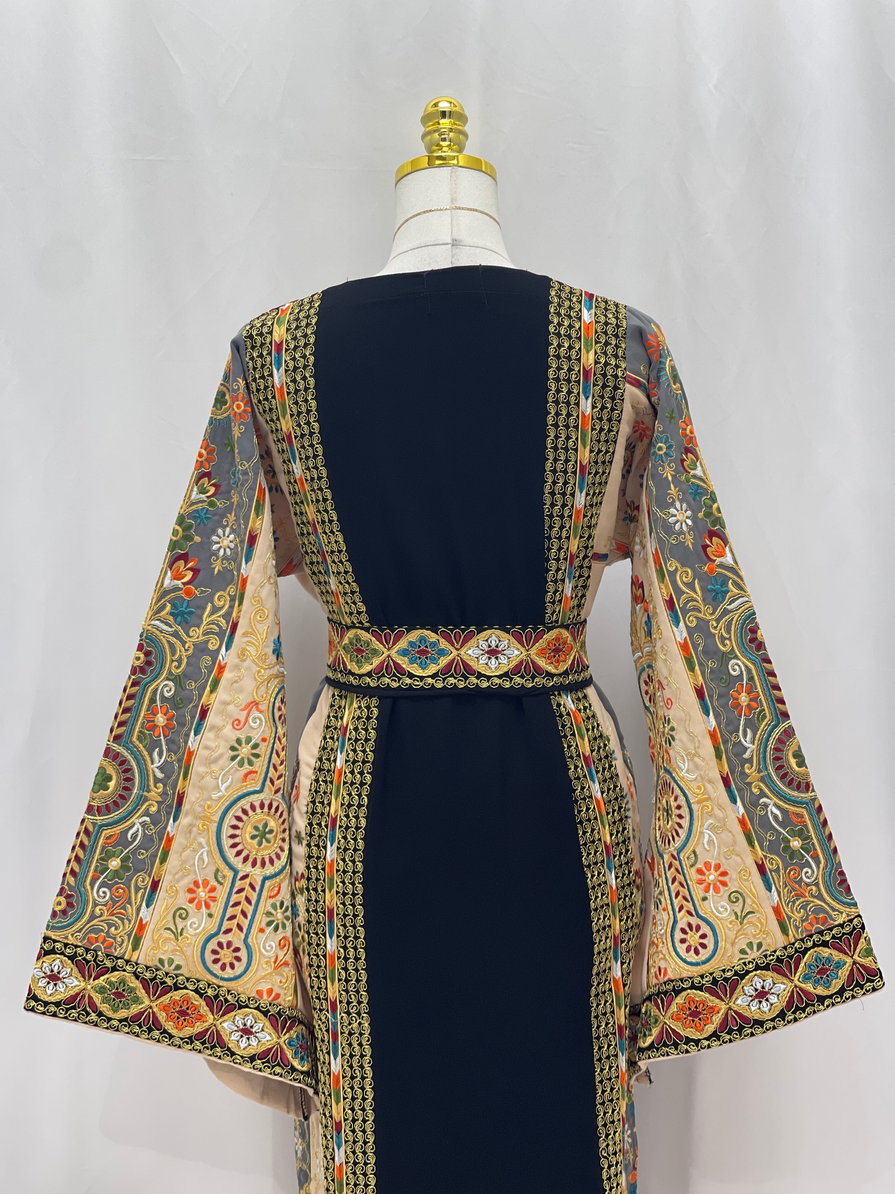 Rafif Embroidered Thobe by Palestinian Elegance navy thobe with intricate embroidered bell sleeves and belt