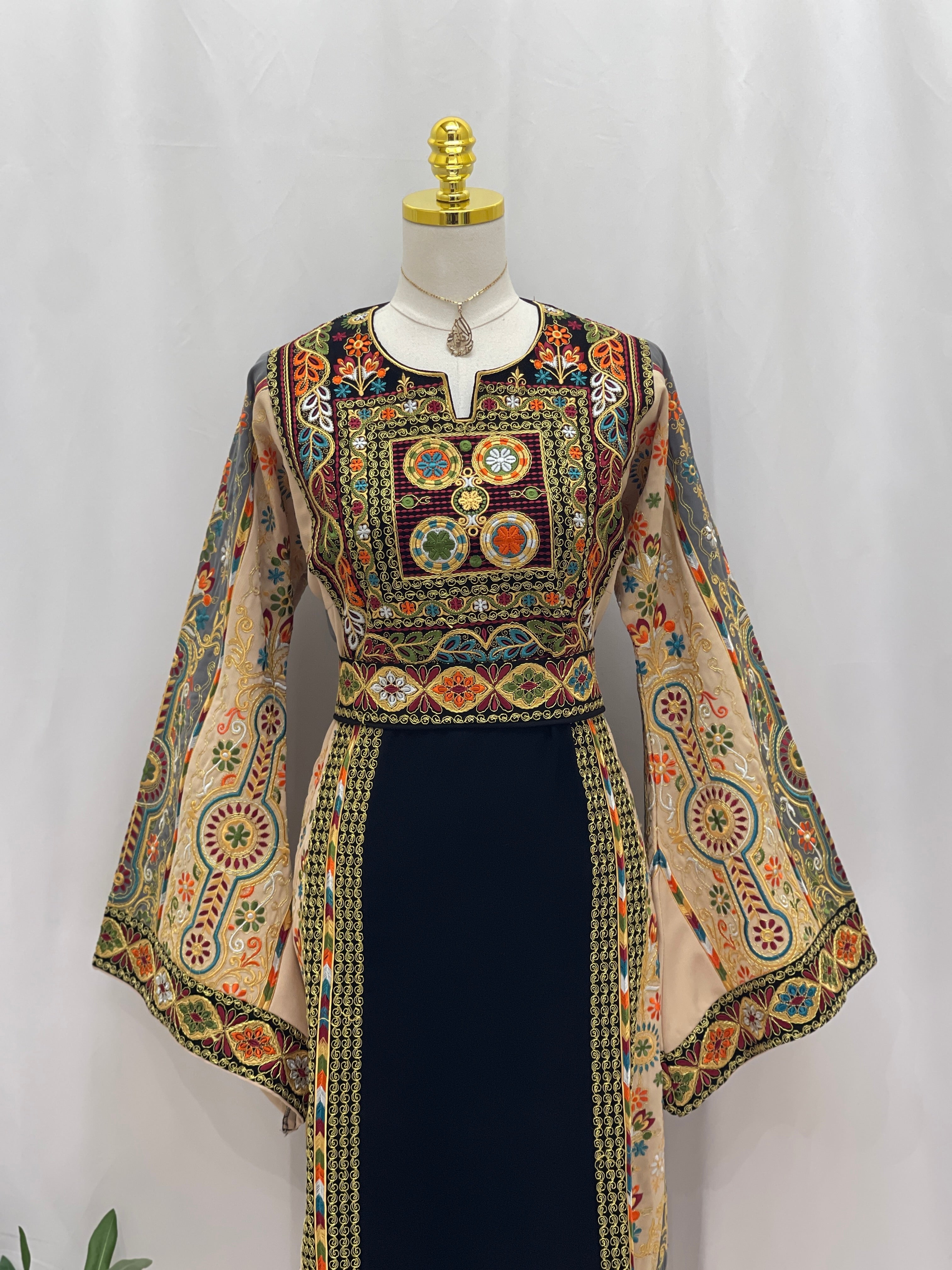 Rafif Embroidered Thobe by Palestinian Elegance navy dress with multicolored Palestinian embroidery and wide bell sleeves