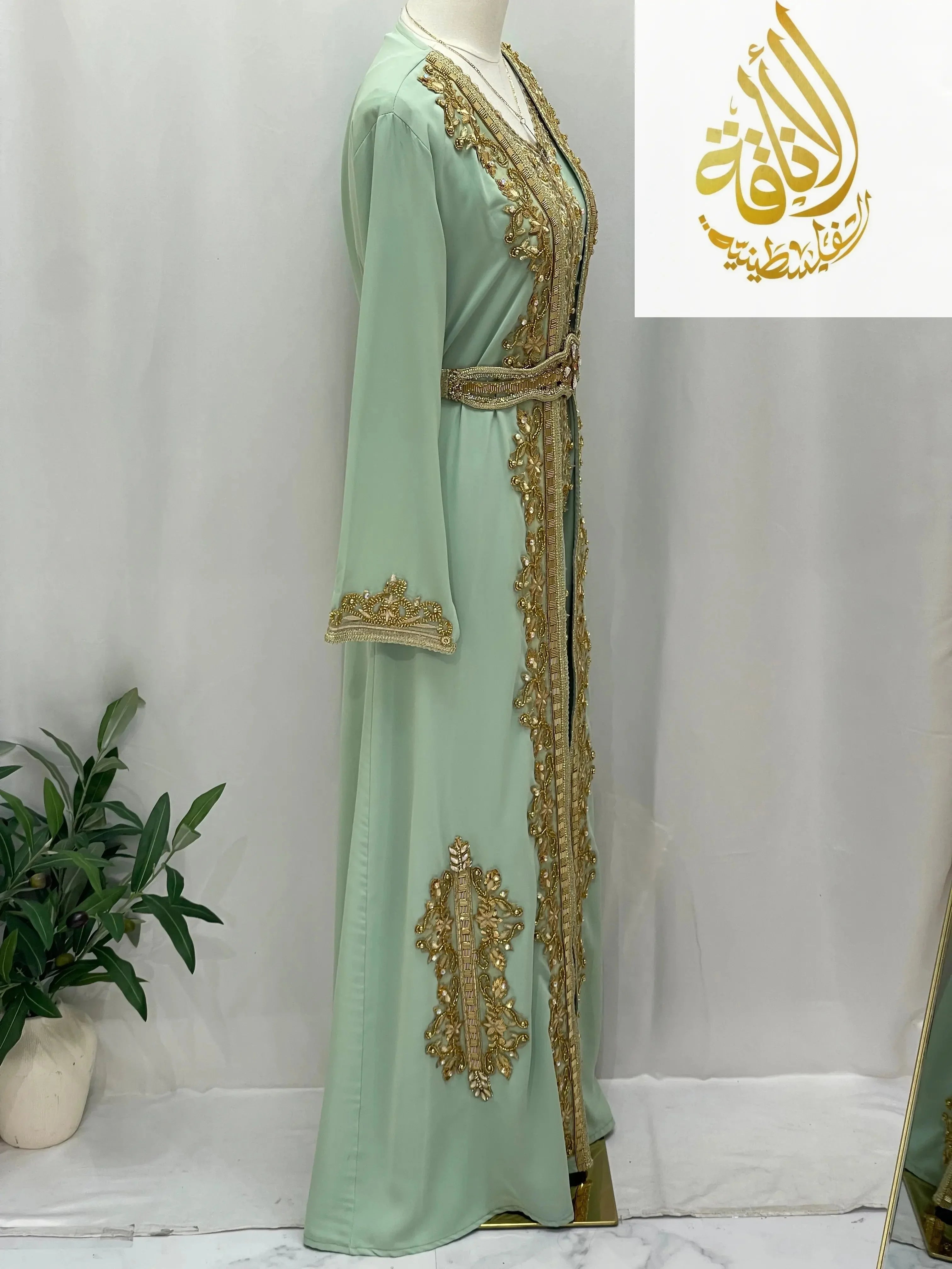 Palestinian Elegance Rahaf Moroccan Style Kaftan in mint green with gold embroidery and a matching belt
