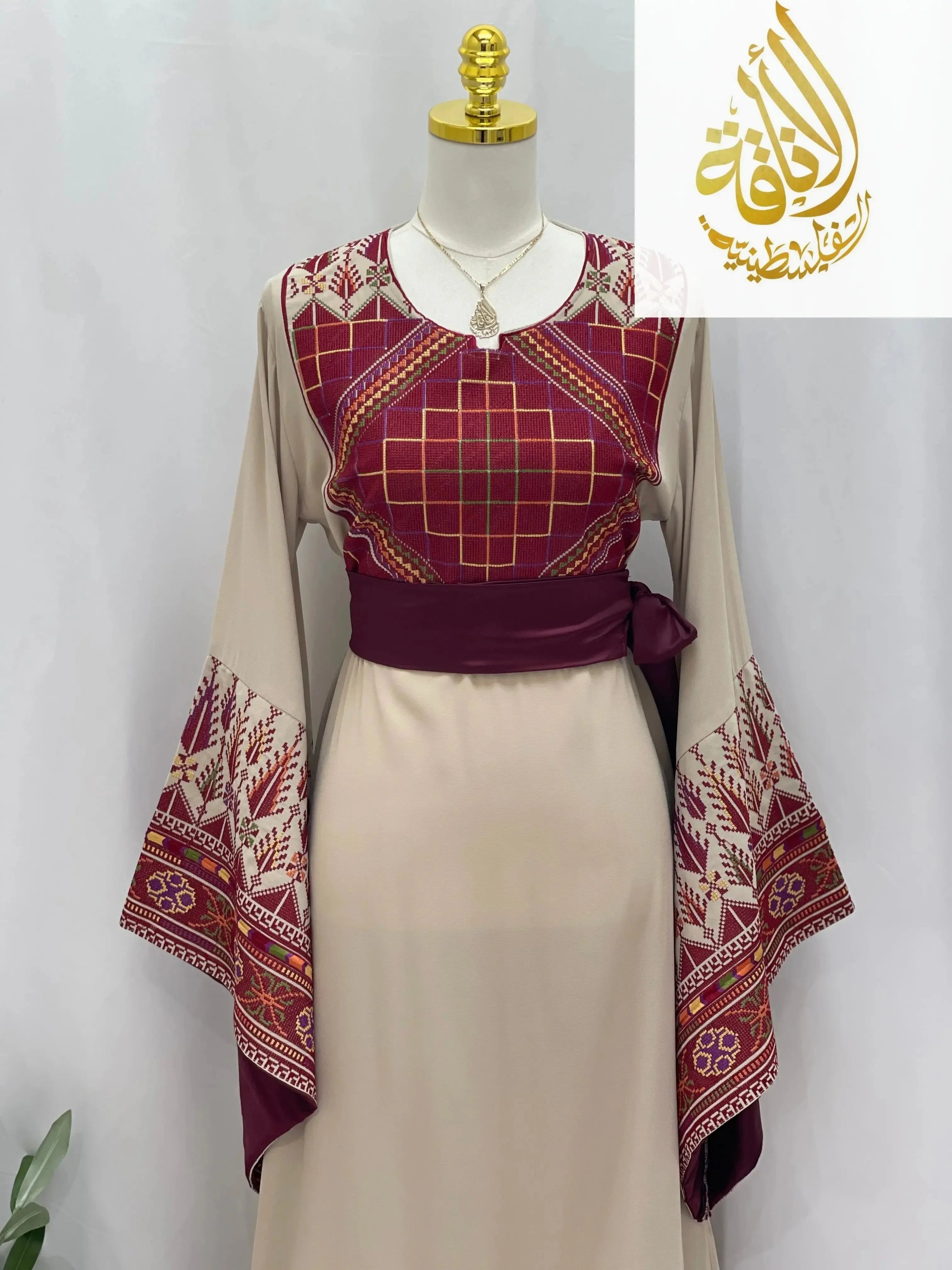 Randa Embroidered Thoub by Palestinian Elegance with intricate maroon and beige embroidery and wide sleeve design