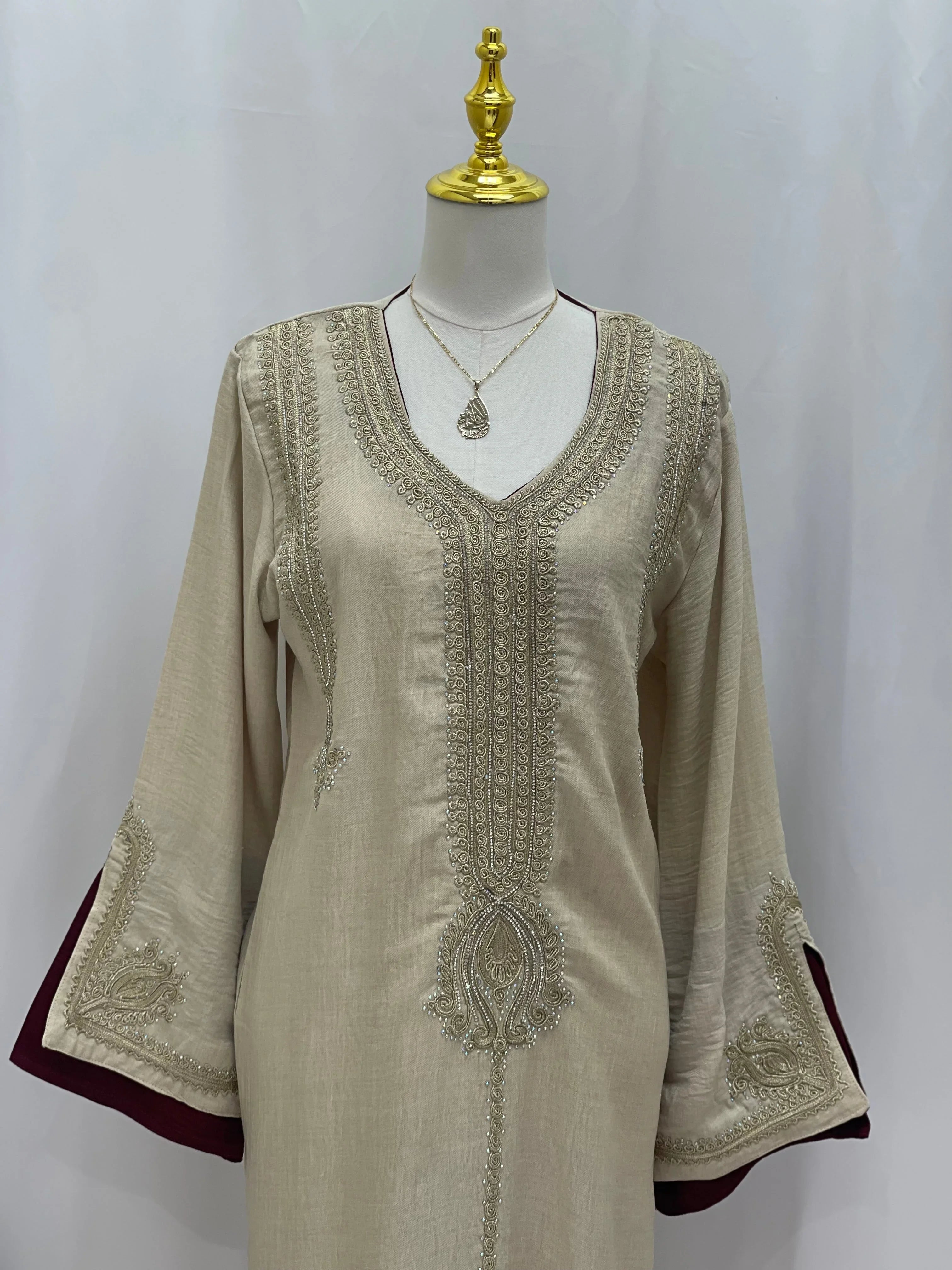 Regal Moroccan Jalabiya by Palestinian Elegance beige embroidered V neck dress with maroon lined bell sleeves