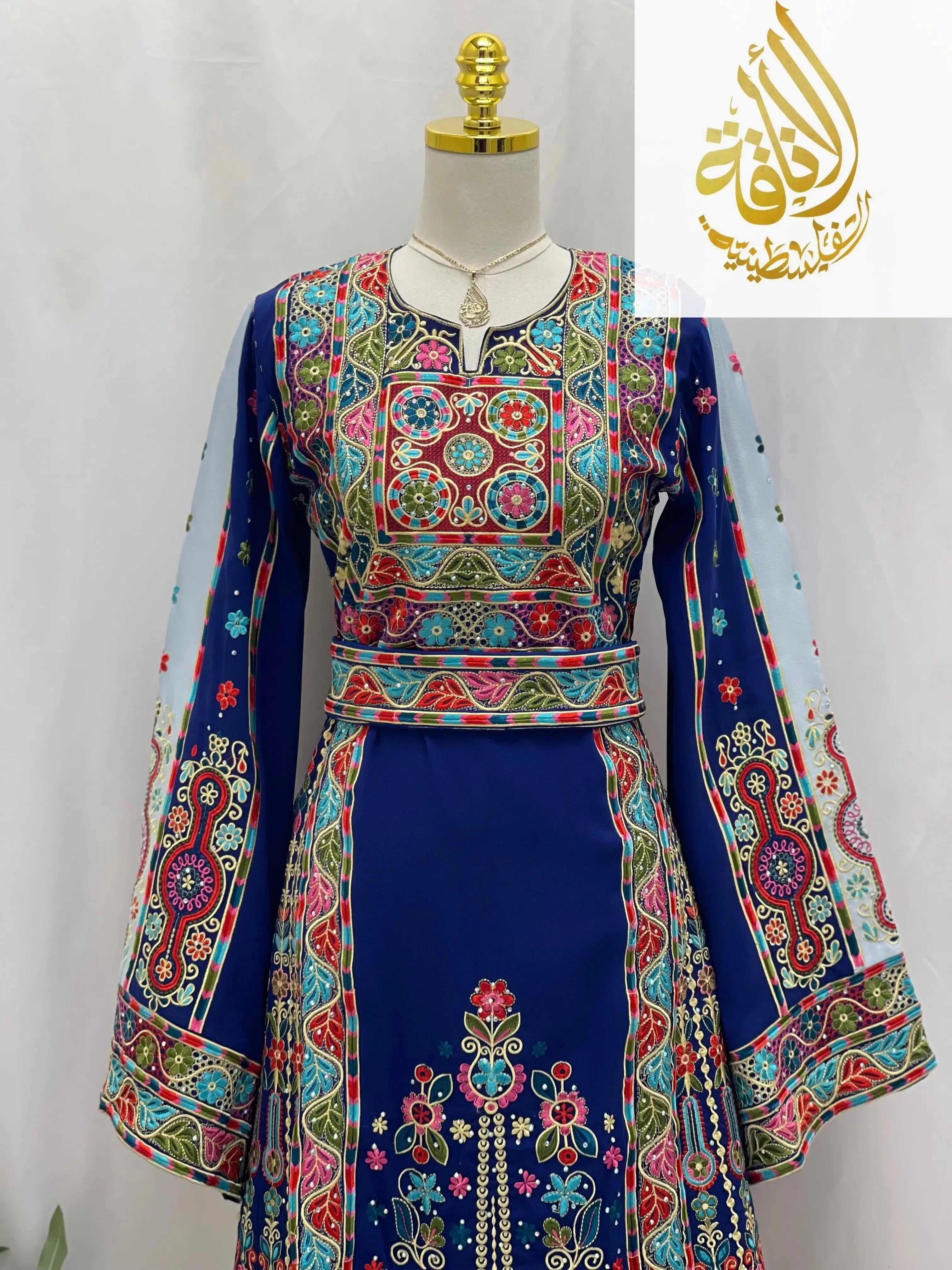 Palestinian Elegance royal blue embroidered thoub with intricate colorful floral and geometric patterns on long sleeves and torso