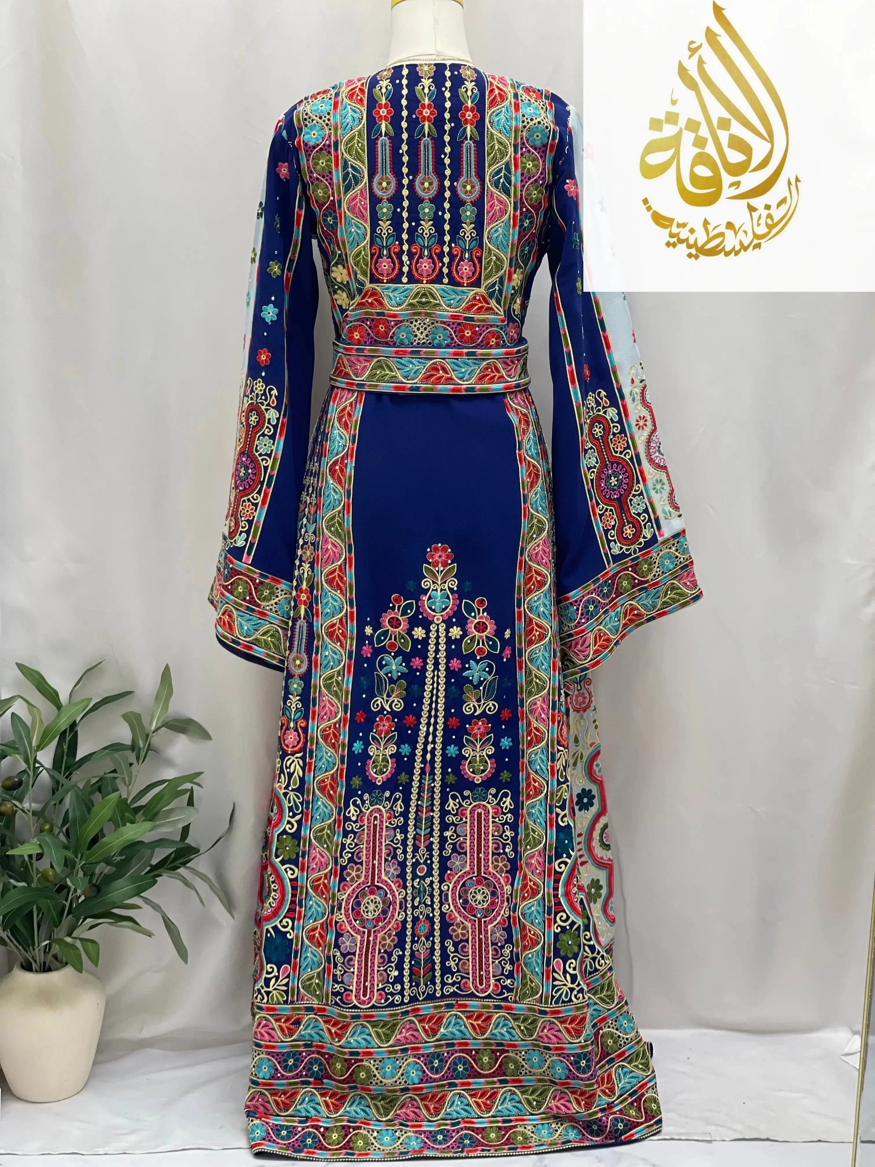 Royal blue embroidered thoub with intricate multicolor Palestinian Elegance embroidery on long sleeves and back