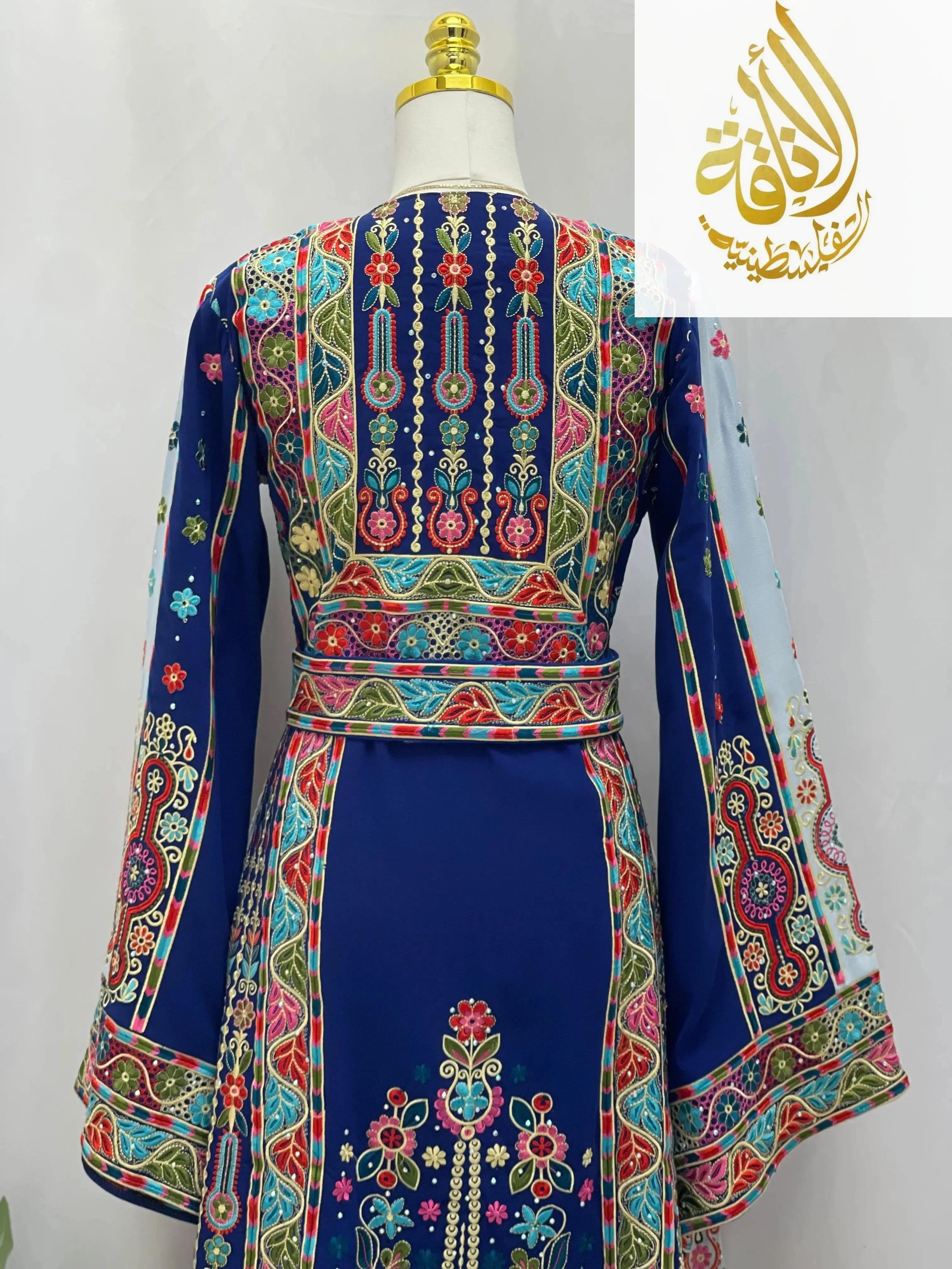 Royal blue embroidered thoub with intricate multicolor floral and geometric embroidery from Palestinian Elegance
