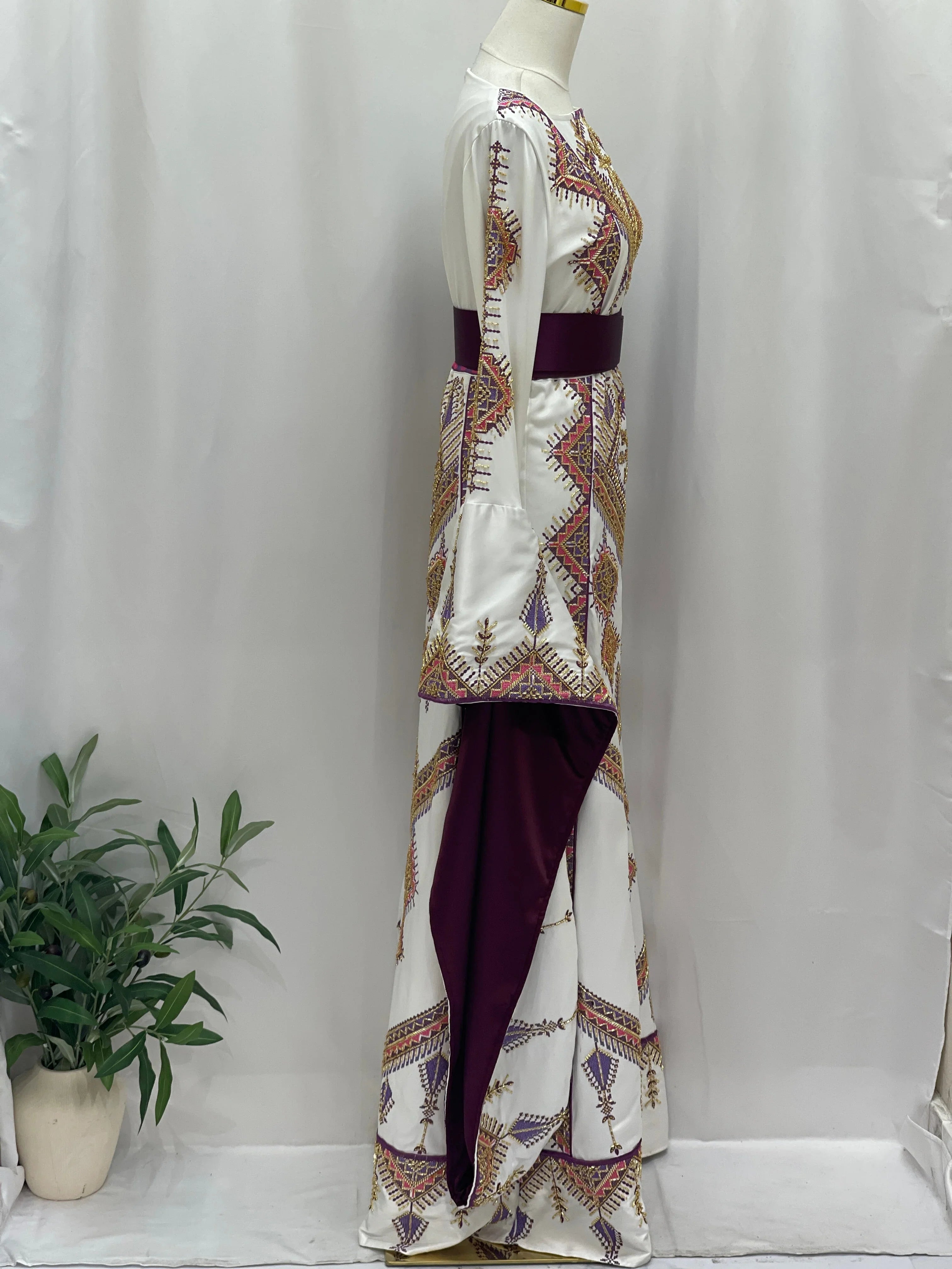 Palestinian Elegance Embroidered Thoub Gown side view white bridal dress with colorful cross stitch and burgundy sash