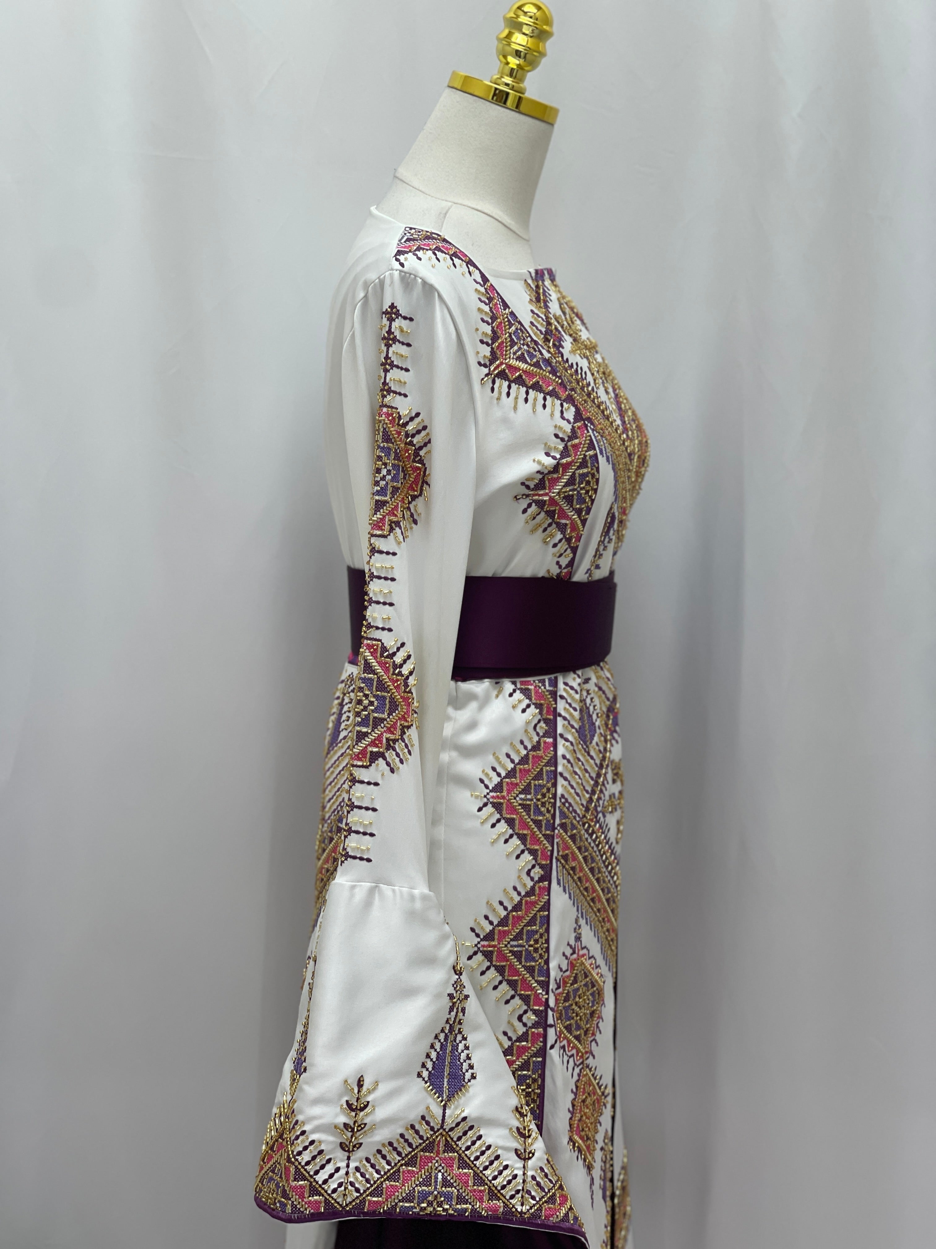 Palestinian Elegance bridal Embroidered Thoub Gown white satin with traditional Palestinian embroidery and purple waist sash