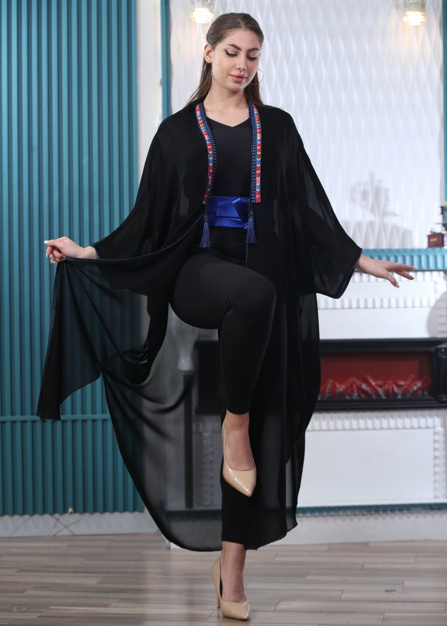 Palestinian Elegance black embroidered chiffon cardigan worn by model with long sheer sleeves and colorful trim