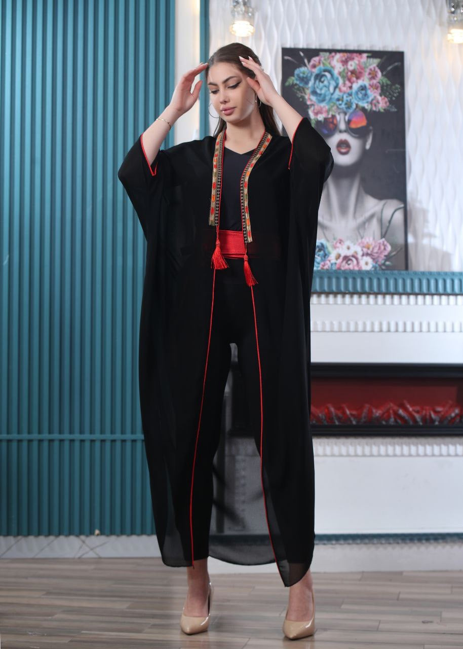 Palestinian Elegance embroidered chiffon cardigan in black with red trim and tassel details