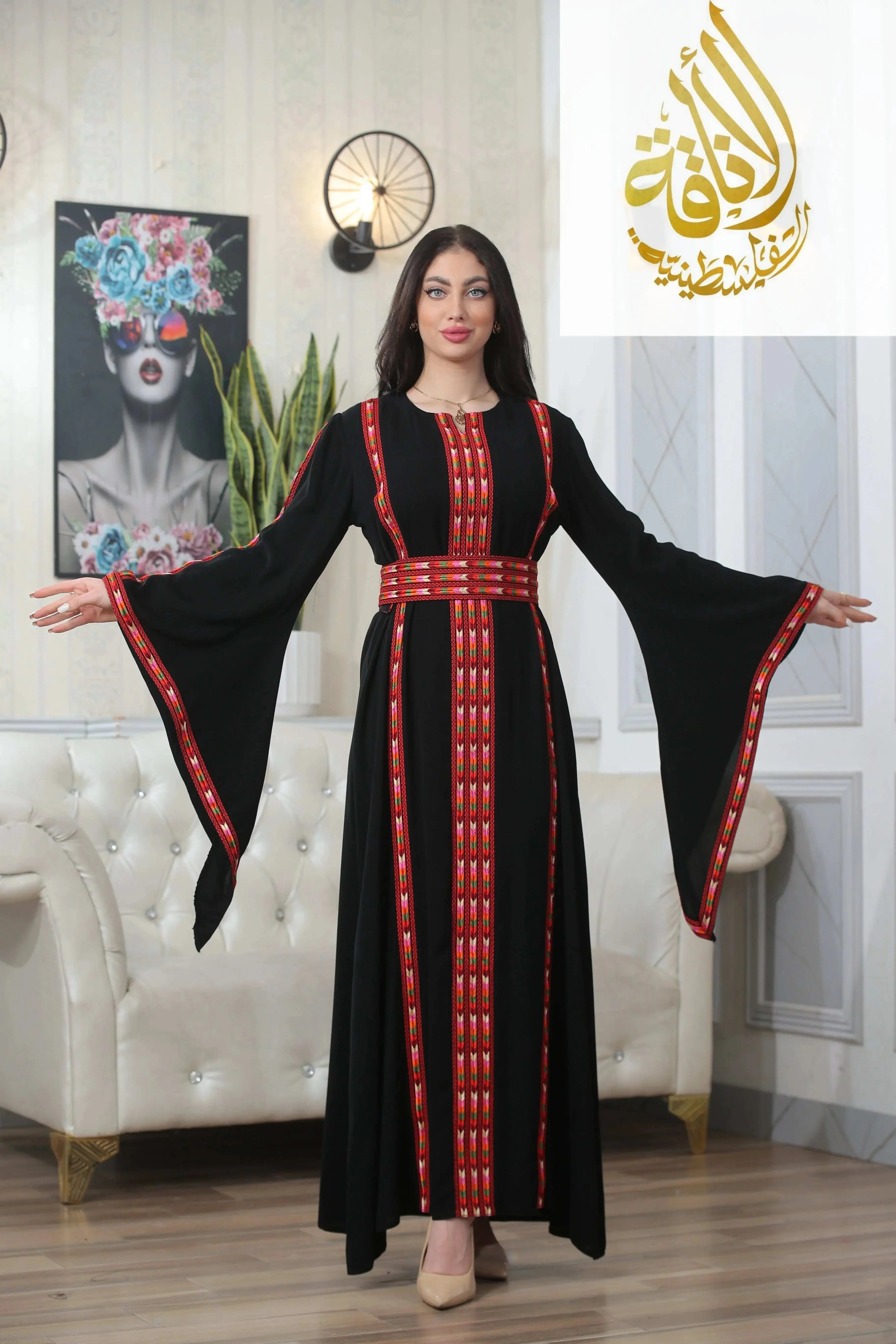 Palestinian Elegance Salam Manjal Embroidered Thoub in black with red embroidery and sleeves