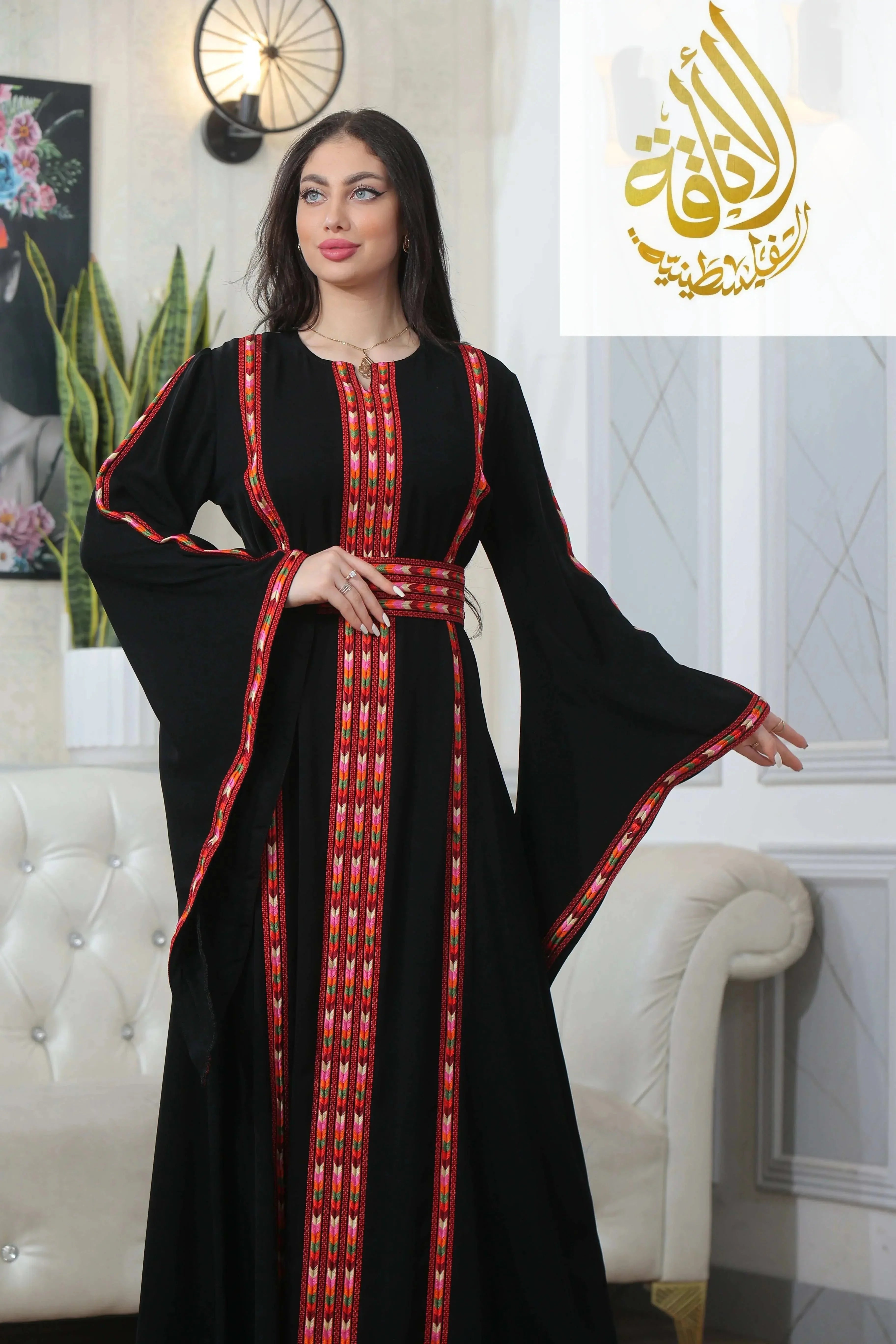 Palestinian Elegance Salam Manjal Embroidered Thoub in black with red embroidery and wide sleeves