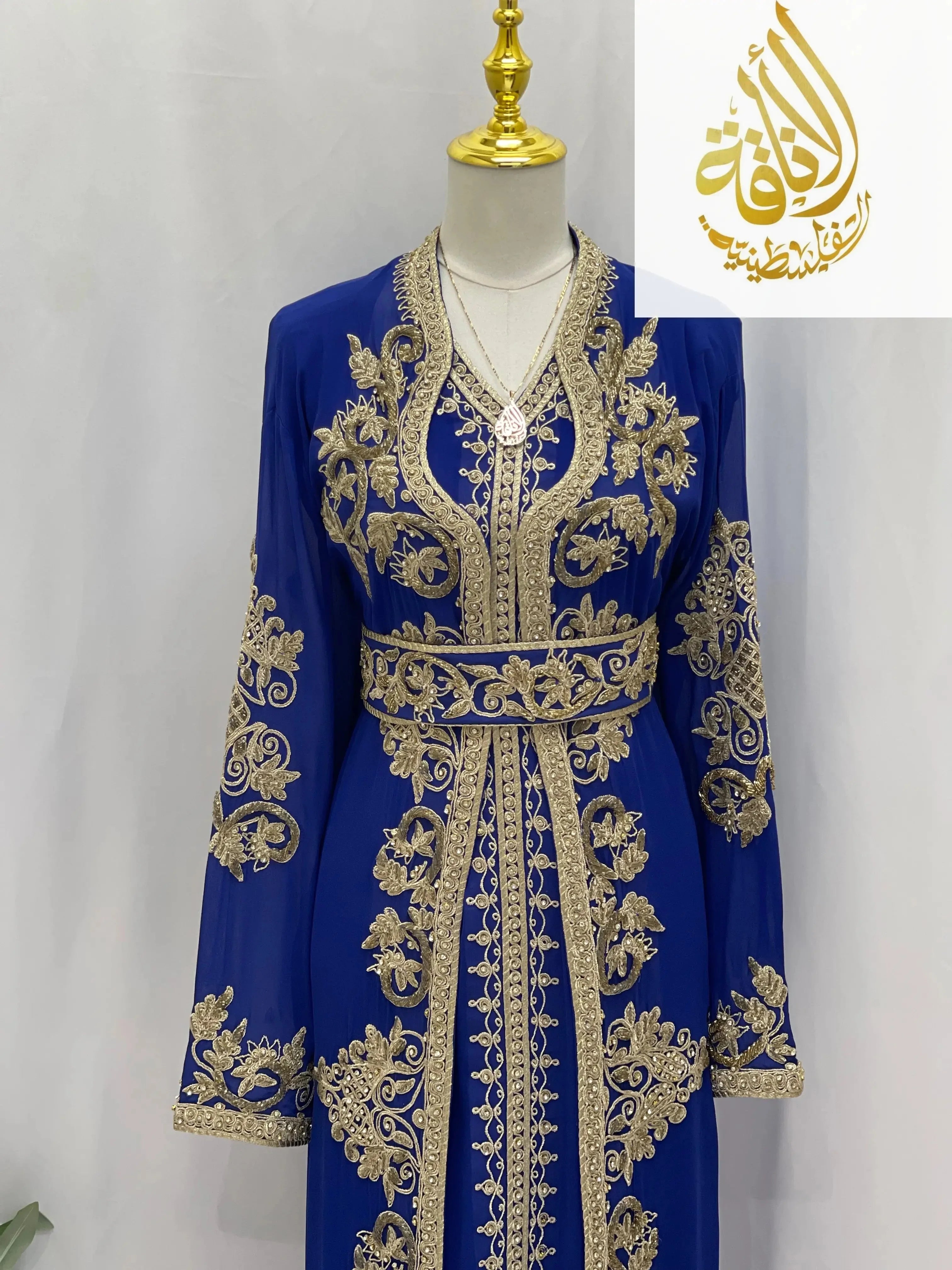 Blue Moroccan Style Kaftan with intricate gold embroidery and matching belt by Palestinian Elegance