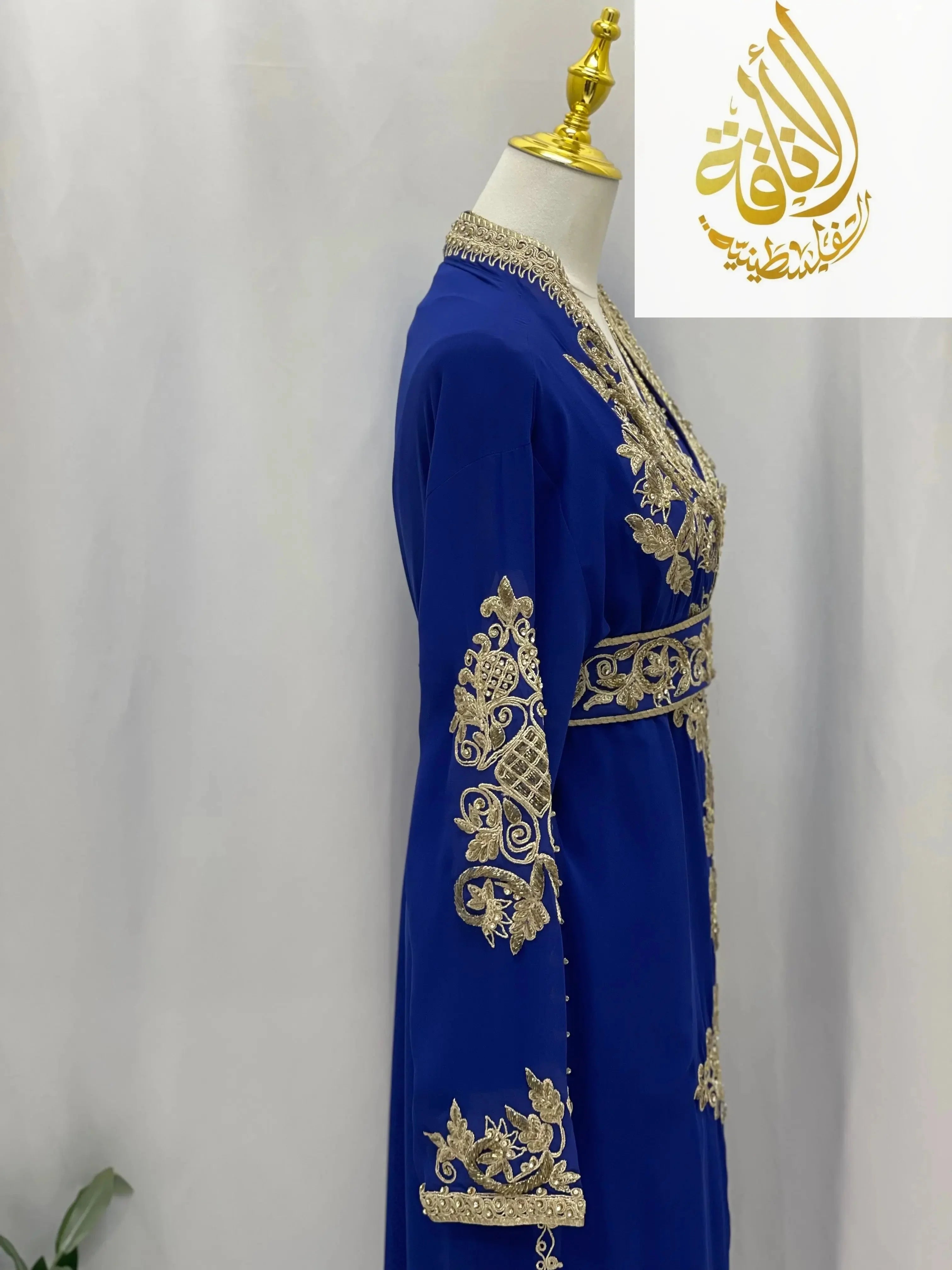 Palestinian Elegance Moroccan Style Kaftan in royal blue with intricate gold embroidery on sleeves and waist
