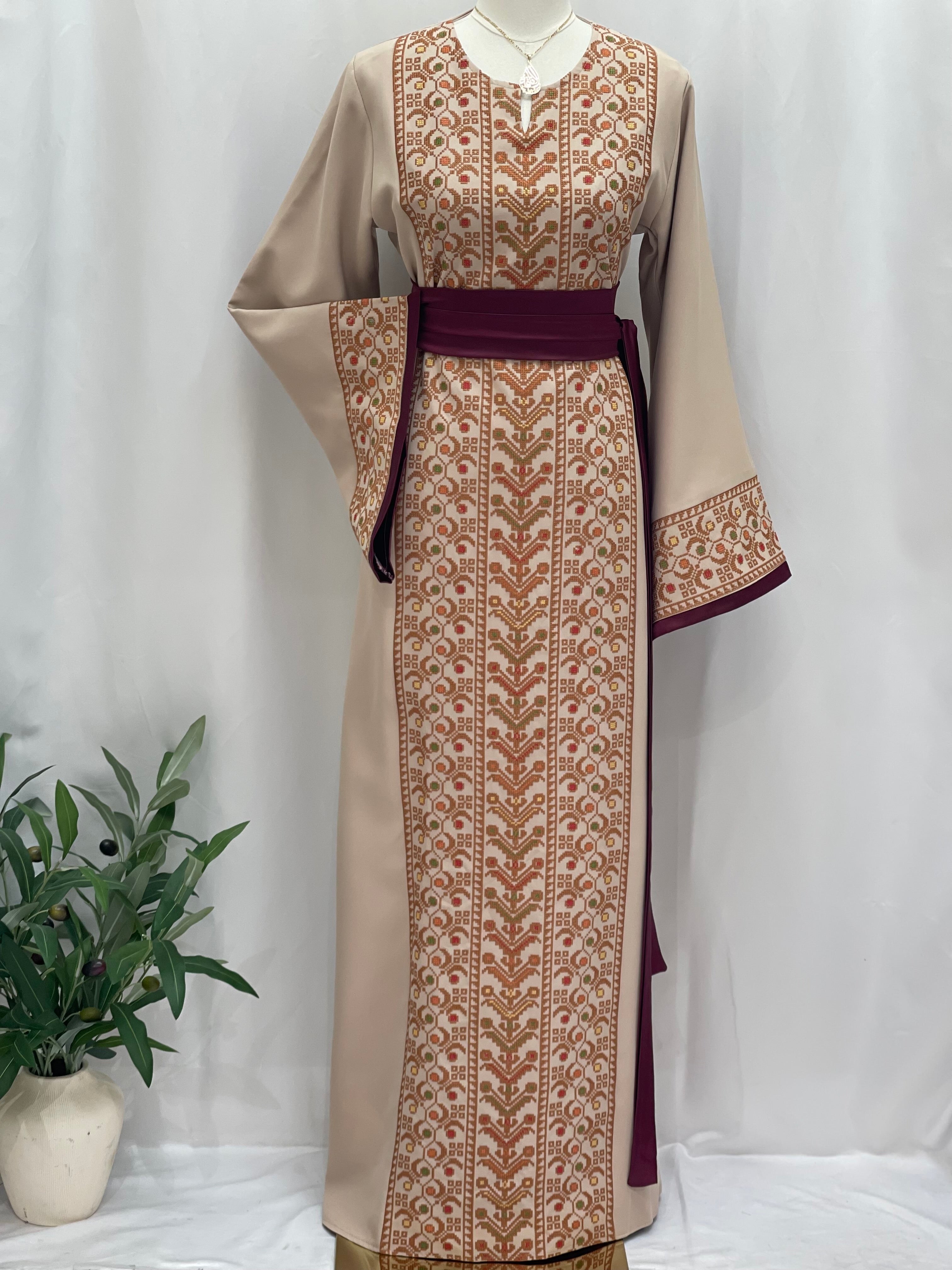 Palestinian Elegance Embroiderd Thobe With Belt in beige and maroon featuring traditional embroidery details