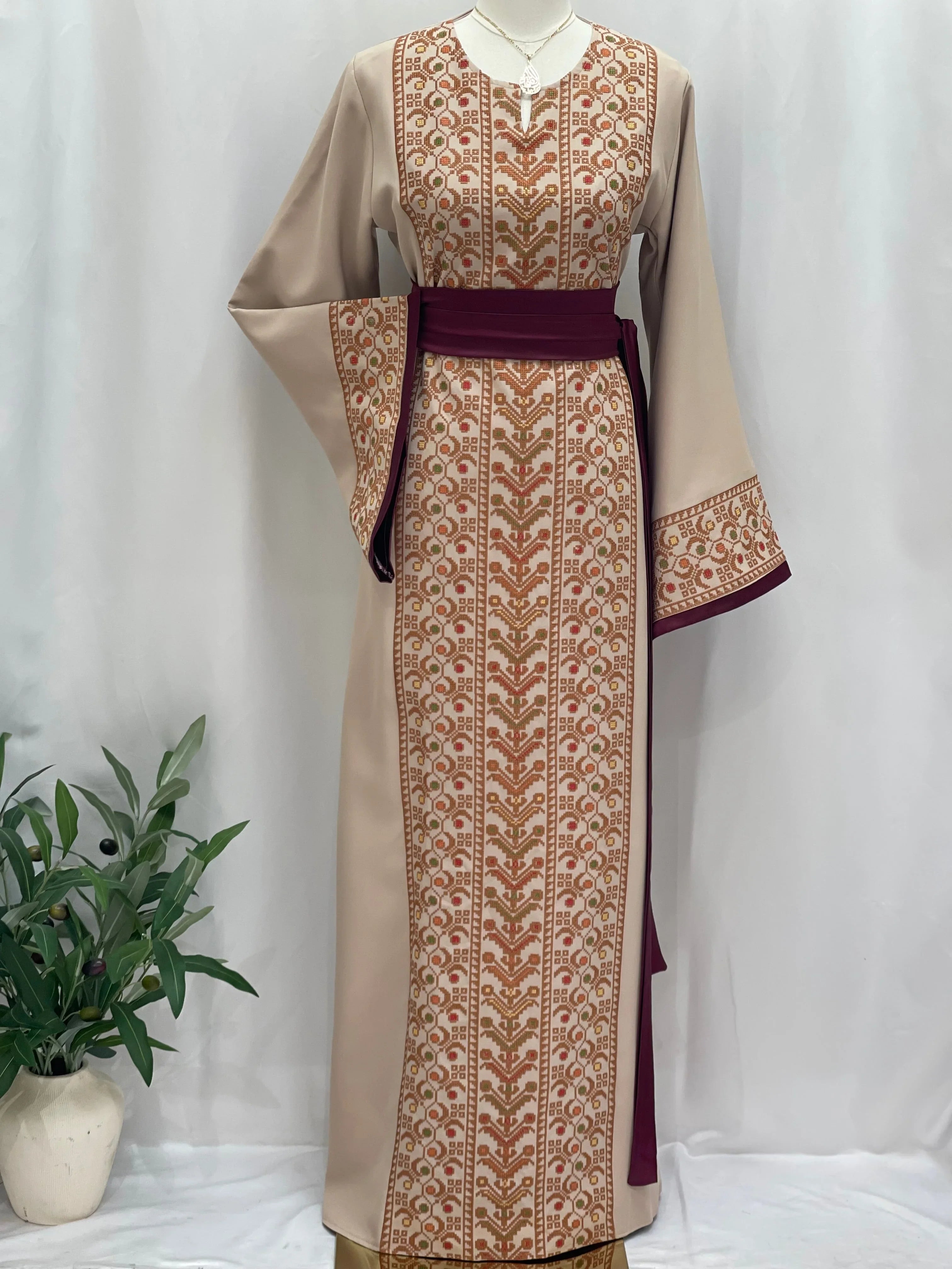 Palestinian Elegance Embroiderd Thobe With Belt in beige and maroon featuring traditional embroidery details