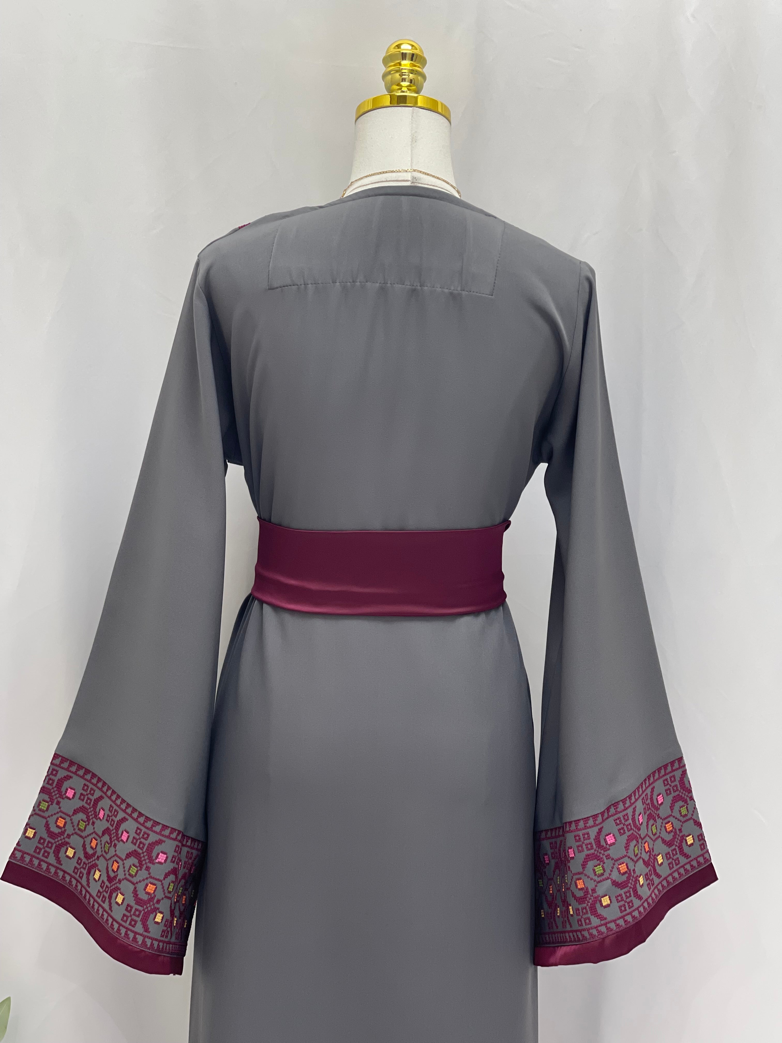 Back view of Palestinian Elegance Embroiderd Thobe With Belt in gray with purple embroidered sleeve cuffs