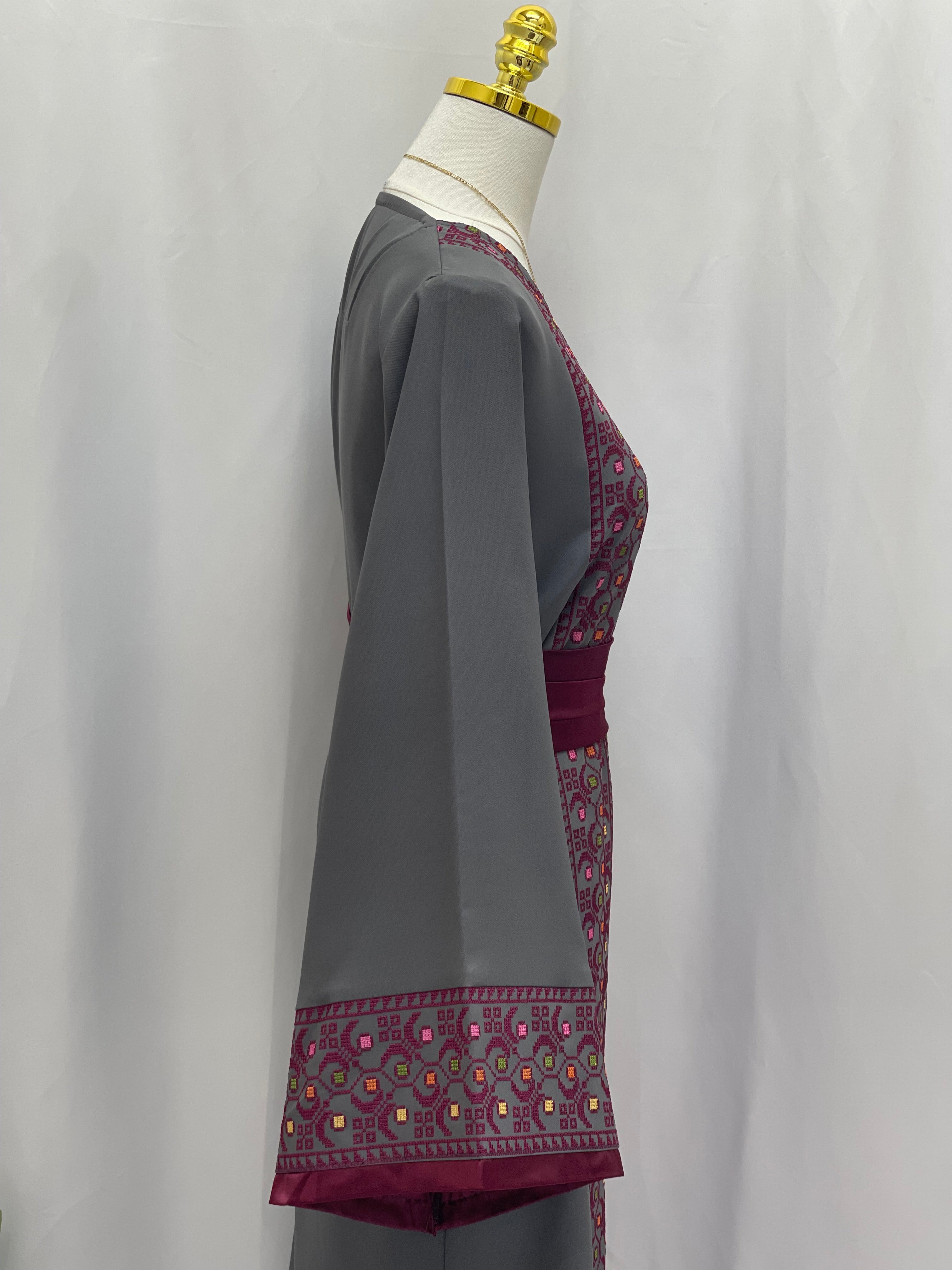 Palestinian Elegance Embroiderd Thobe With Belt featuring gray fabric and intricate purple embroidery details