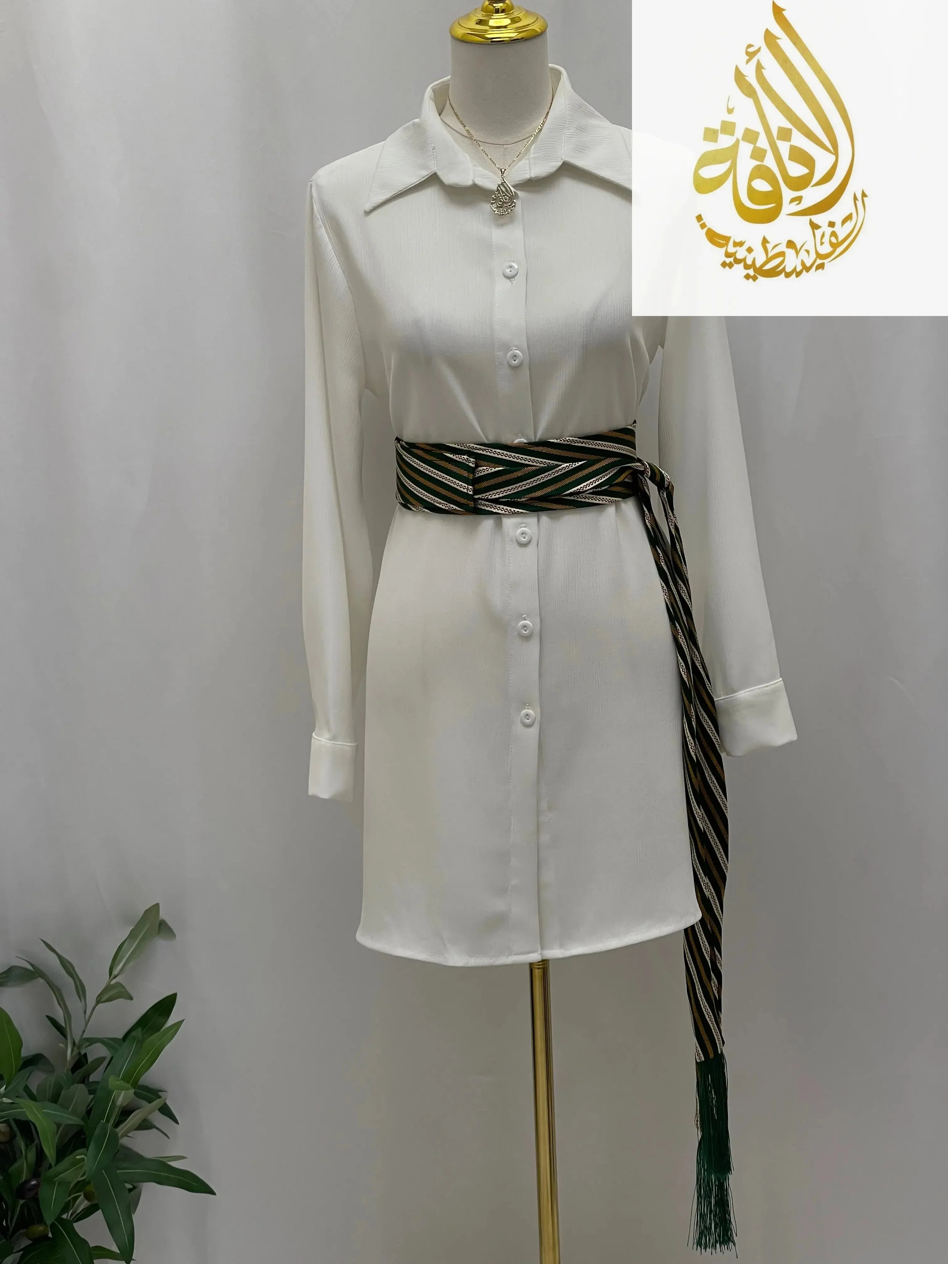 Palestinian embroidered belt with striped pattern wrapped on white button-down dress