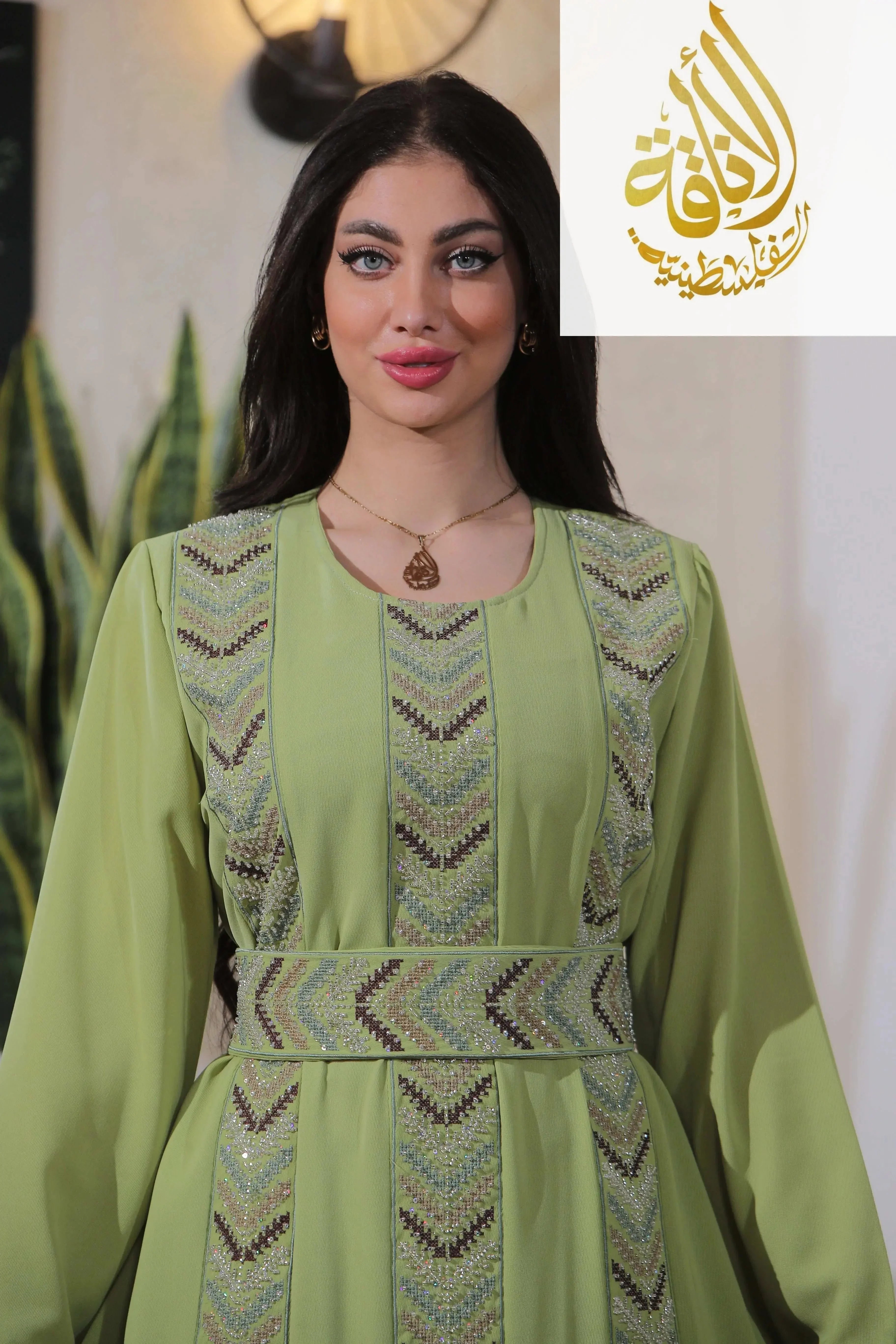 Palestinian Elegance Seham Embroidered Beads Thoub in light green with intricate beadwork and embroidery