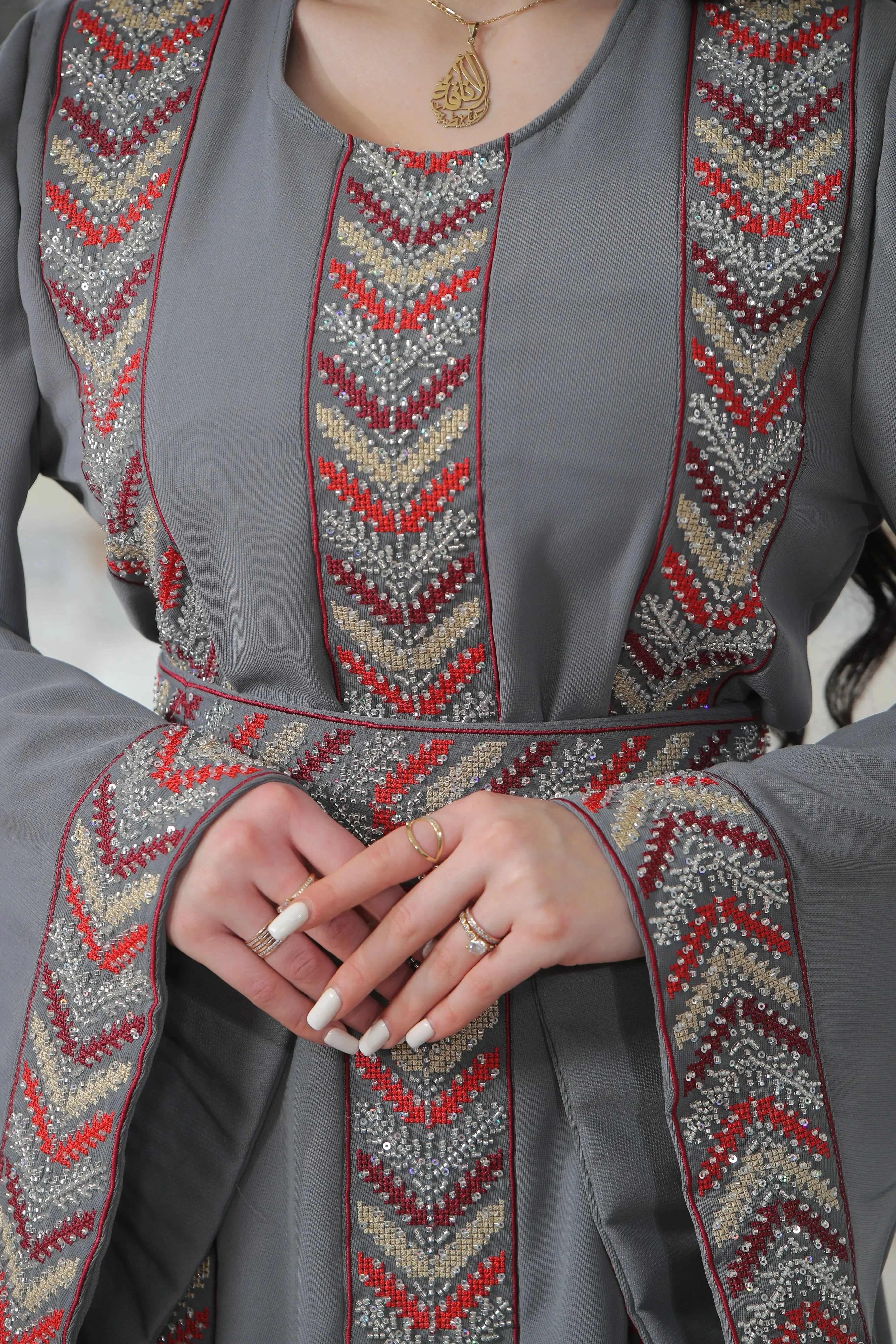 Palestinian Elegance beaded thobe dress for women in gray with intricate embroidered patterns elegant