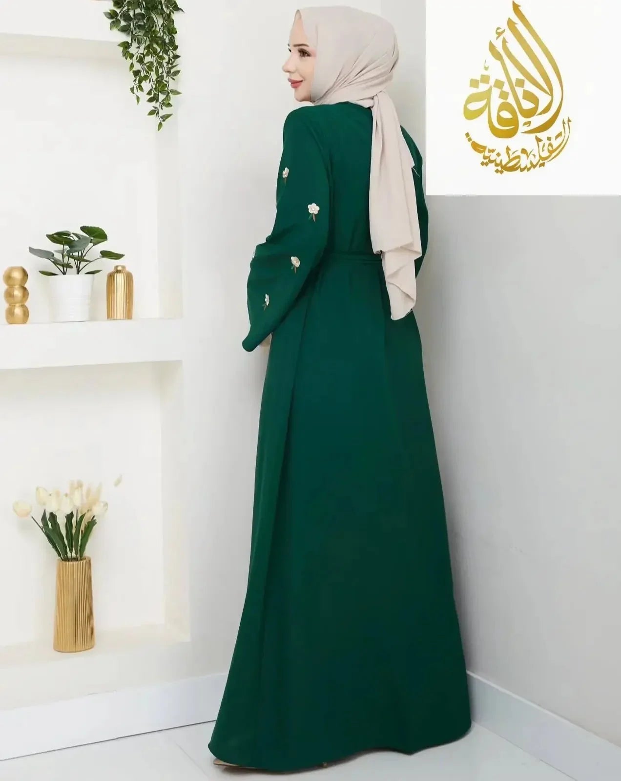 Palestinian Elegance modern abaya set in deep green with floral embroidery on sleeves