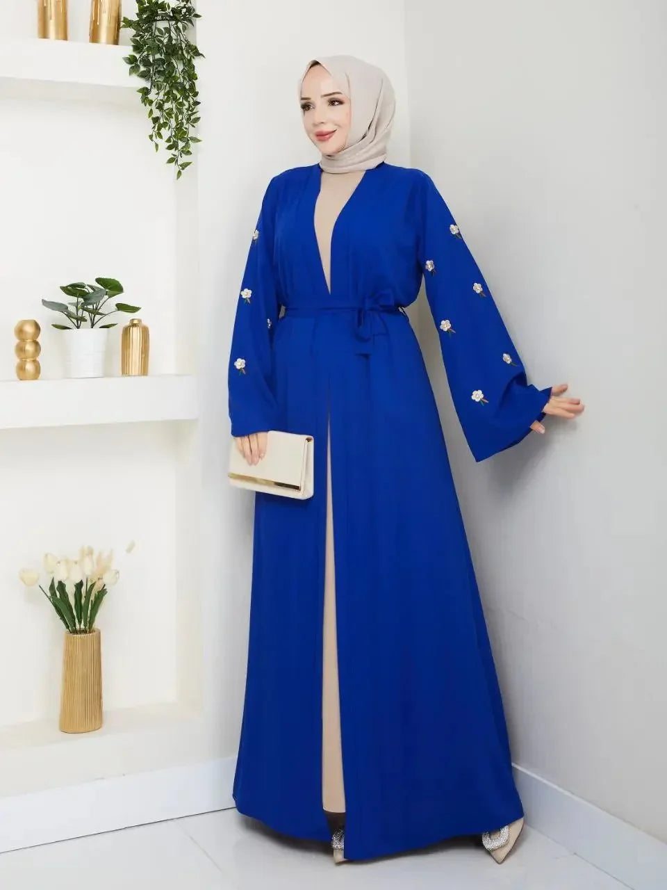Palestinian Elegance blue modern abaya set with floral embroidery and waist tie worn with beige hijab