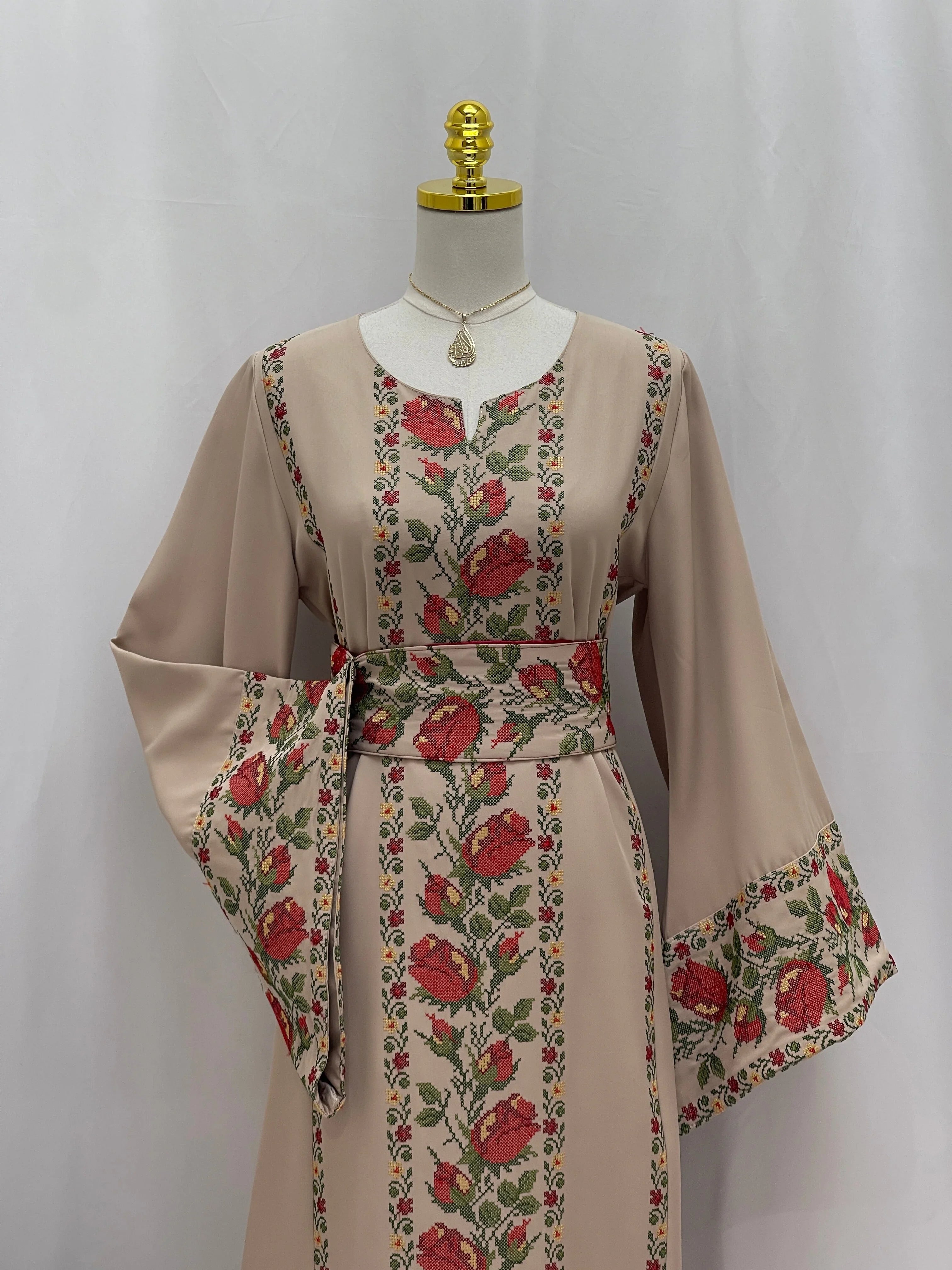 Elegant Shaqaeq Embroidered Thobe with floral design and flowing sleeves for festive occasions
