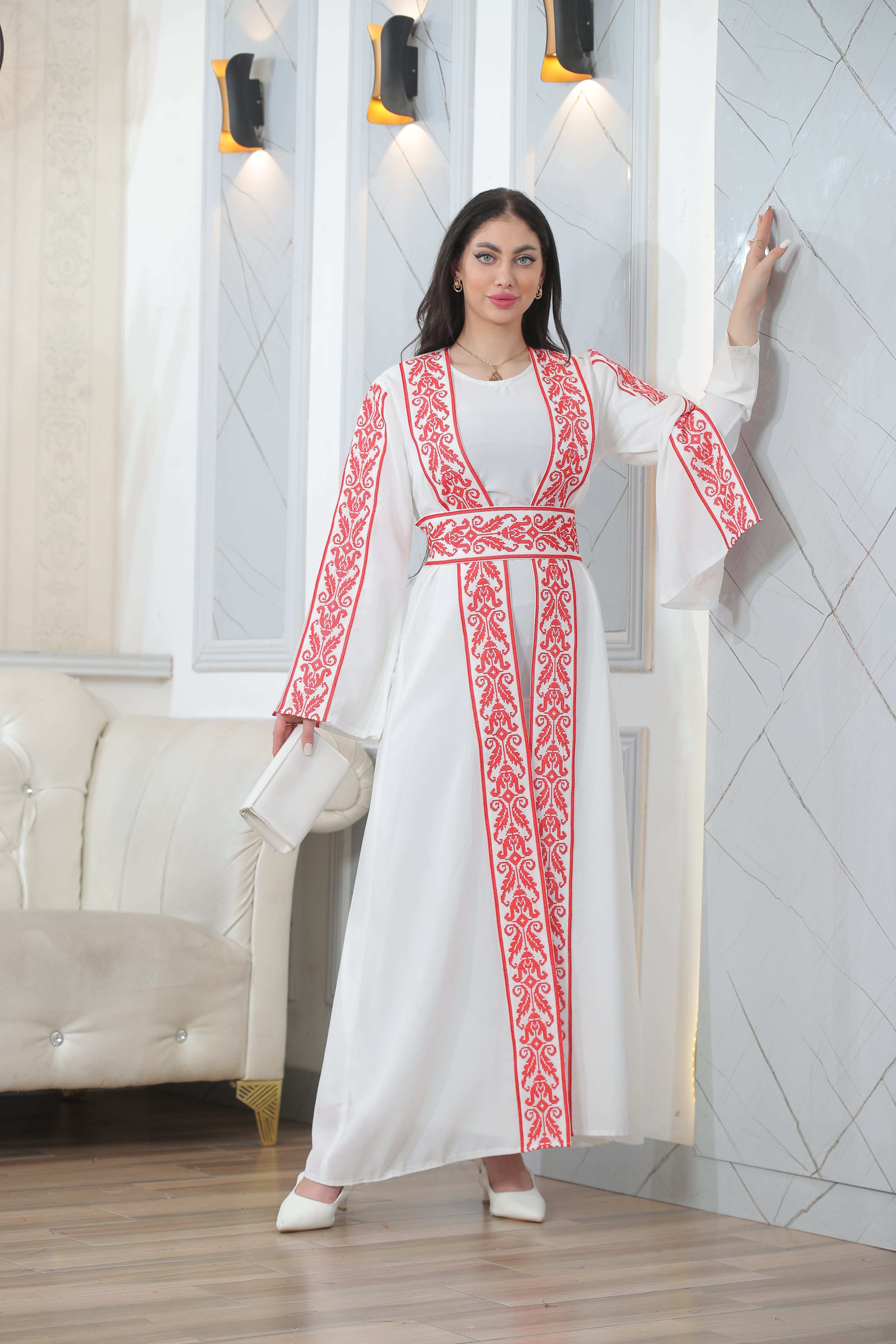 Woman wearing Shereen Embroidered Bisht Abaya white thoub with red embroidery by Palestinian Elegance