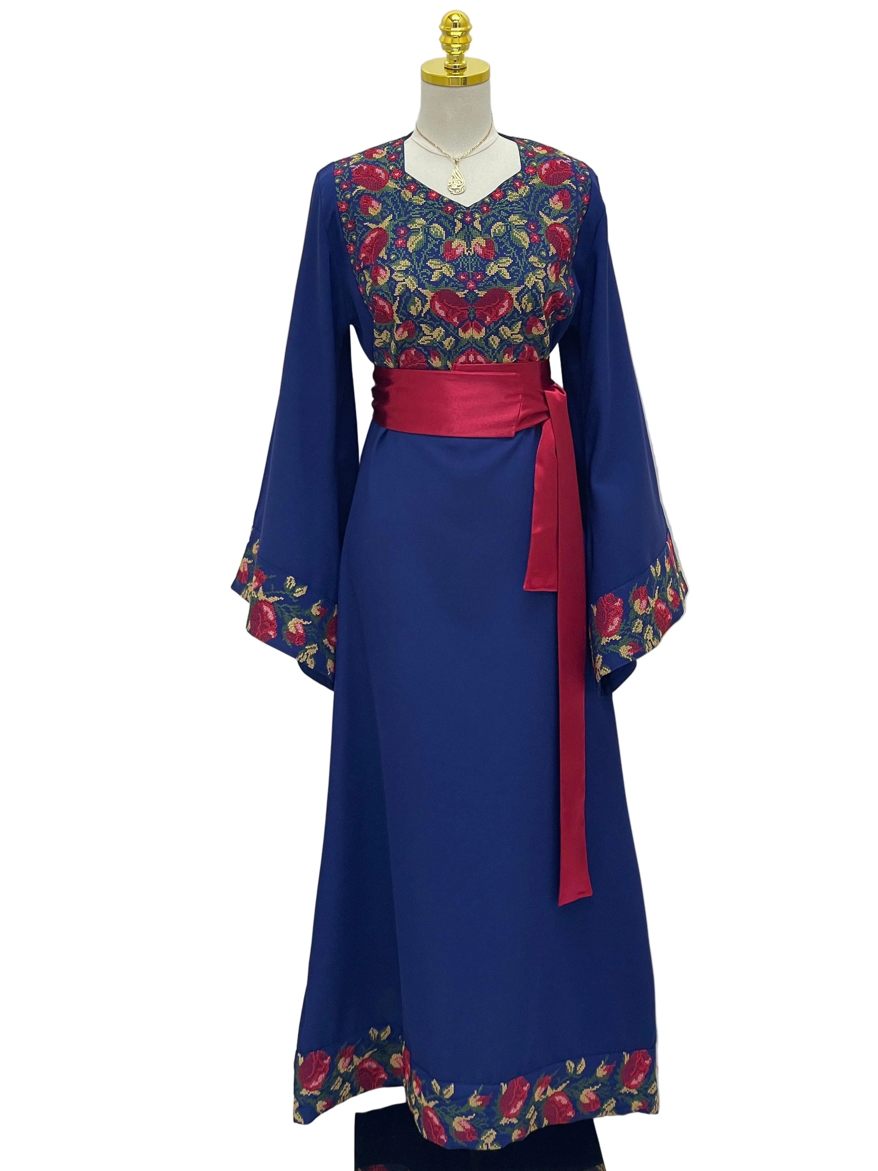 Palestinian Elegance Blossom Royal Blue Thobe with floral embroidery red sash belt and wide sleeves