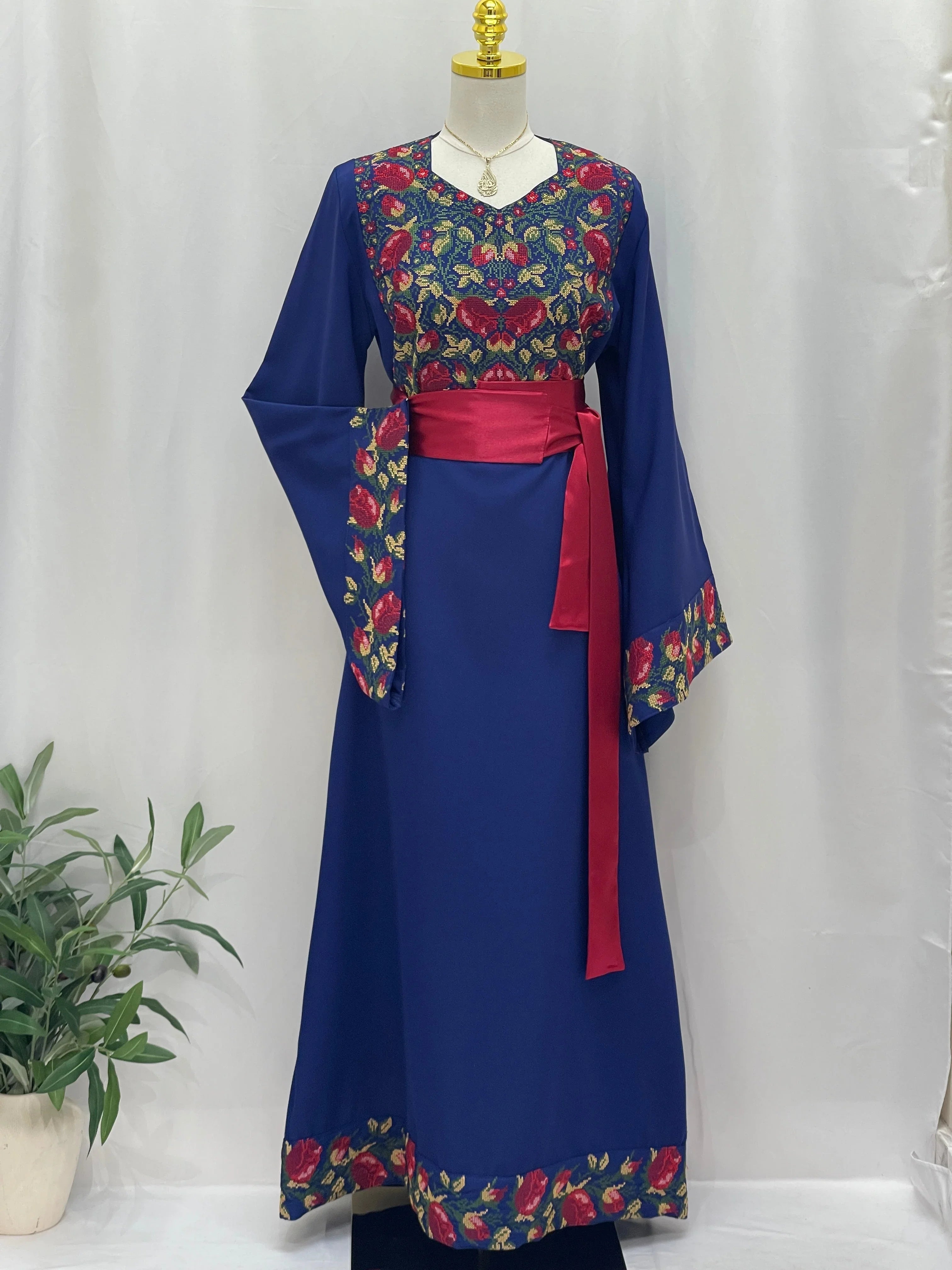 Palestinian Elegance Blossom Royal Blue Thobe embroidered floral yoke and cuffs with sash belt