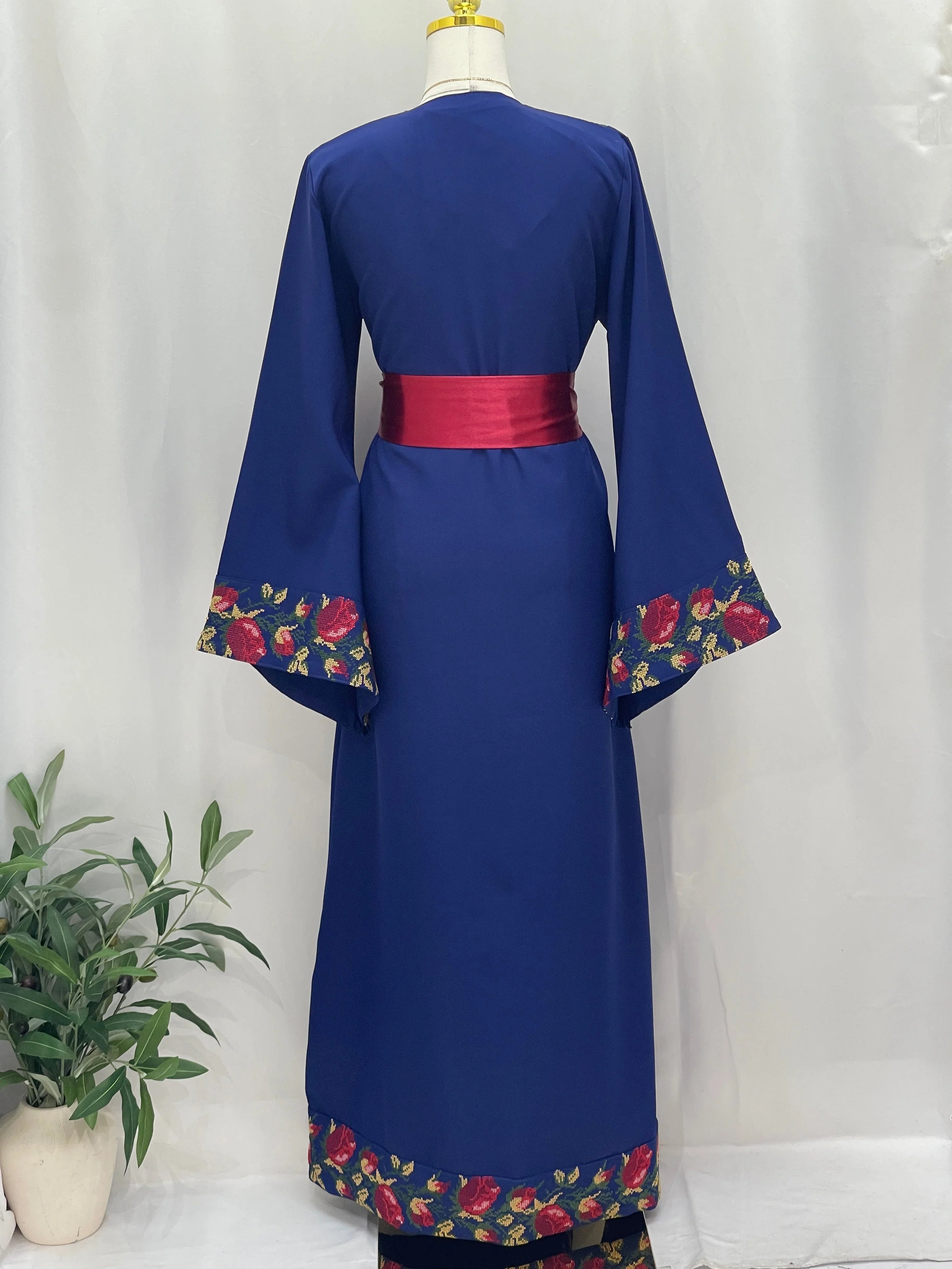 Blossom Royal Blue Thobe embroidered floral hem and wide sleeves with red sash belt by Palestinian Elegance