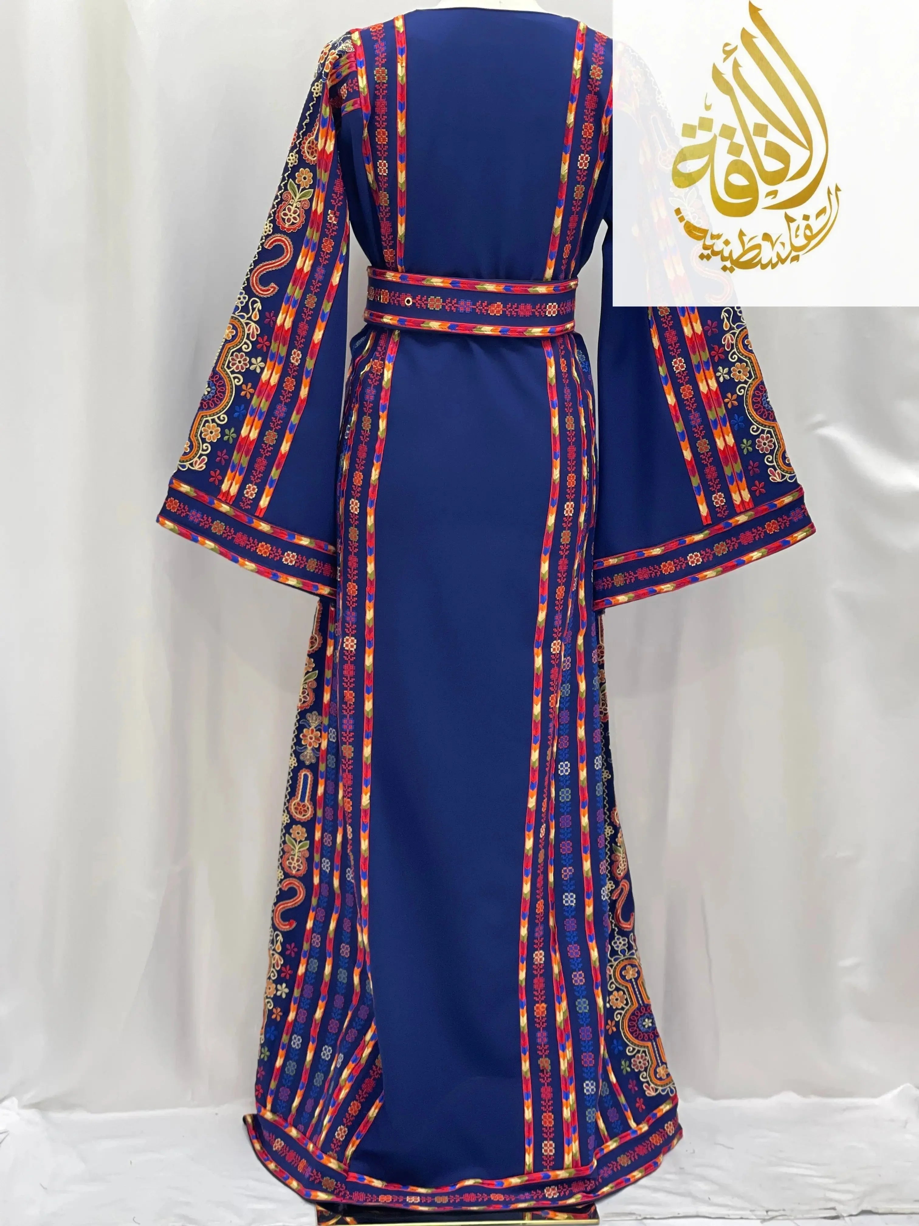 Back view of a blue embroidered Palestinian dress with colorful traditional Palestinian Elegance embroidery