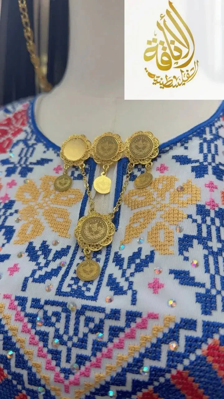 Palestinian Elegance traditional gold brooch made of imitated gold with coin details on embroidered garment