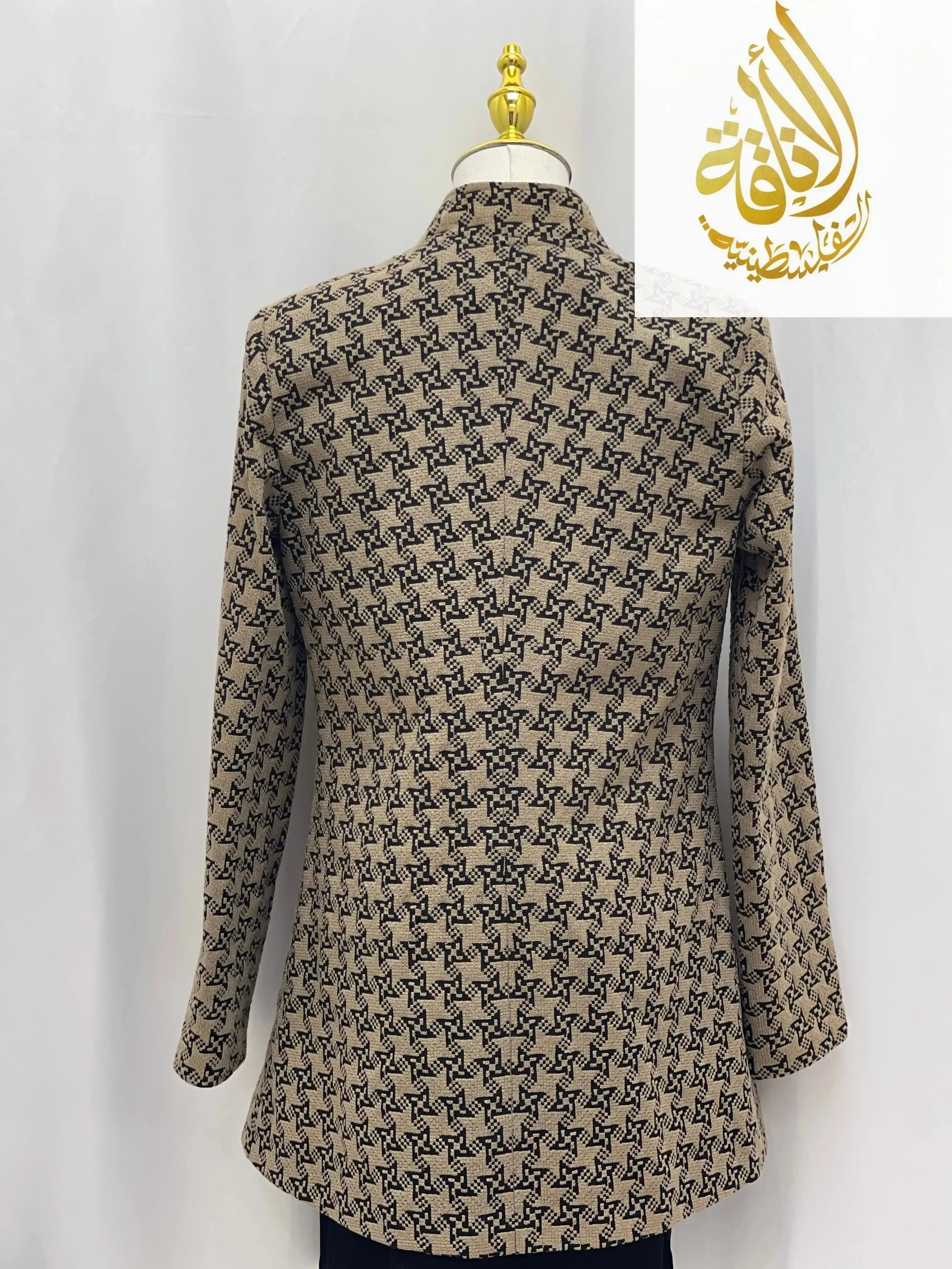Back view of embroidered Palestinian blazer by Palestinian Elegance in beige with black geometric patterns