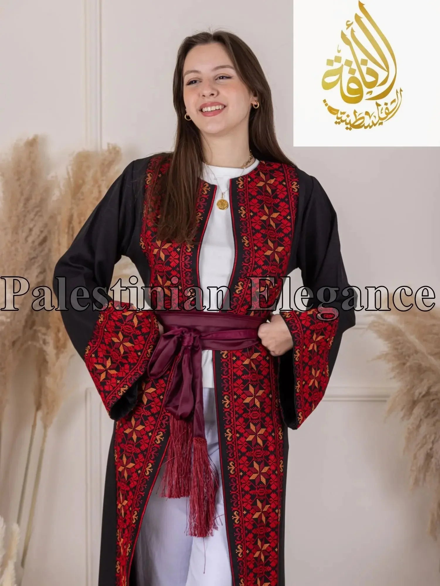 Palestinian Elegance thoub featuring traditional Tahreer Embroidery Bisht in black and red with maroon sash